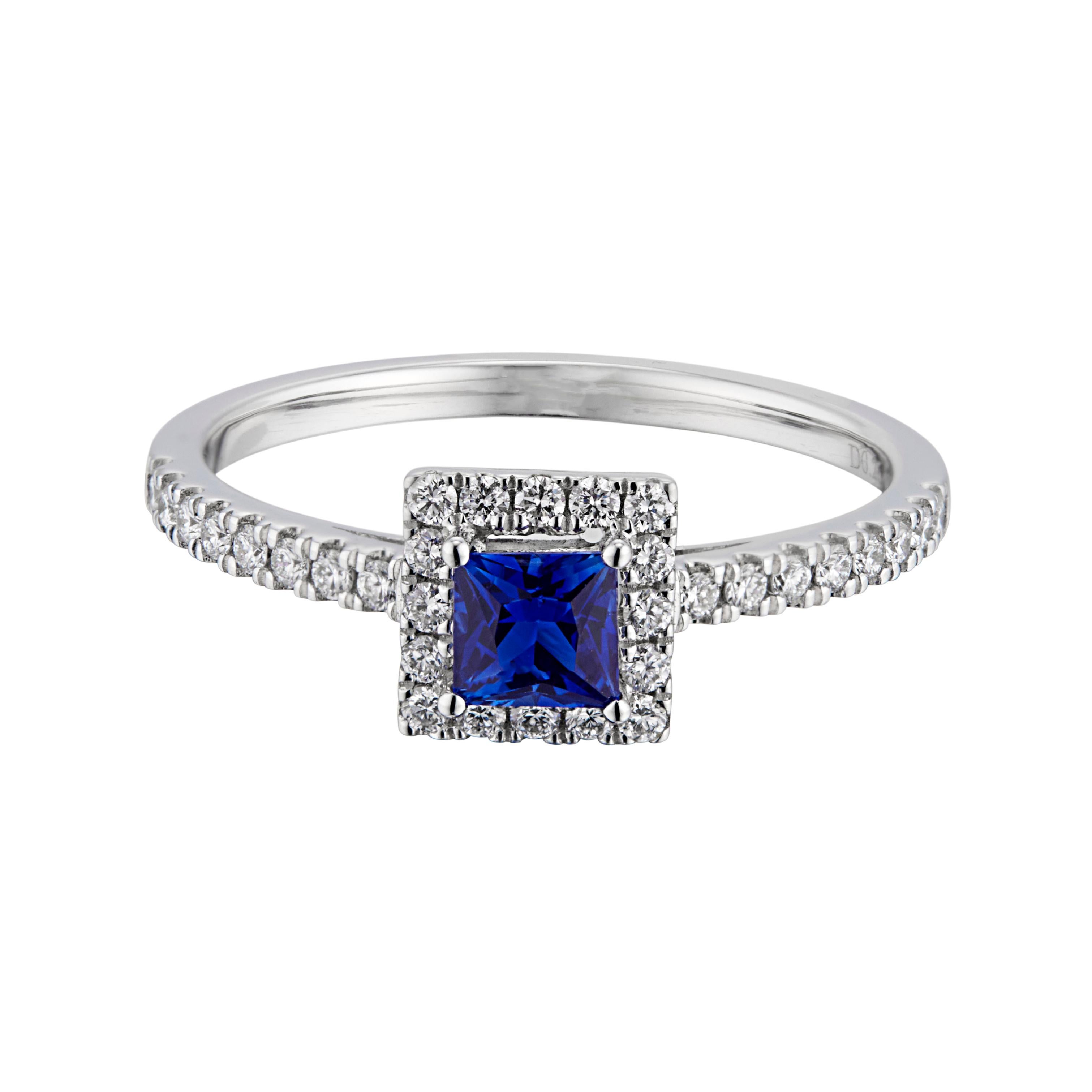 Sapphire and diamond engagement ring. Square cut center sapphire with a halo of round cut diamonds in a 14k white gold setting with diamonds along each side of the shank. 

1 blue sapphire, approx. .46cts
32 round diamonds, G VS-SI approx.