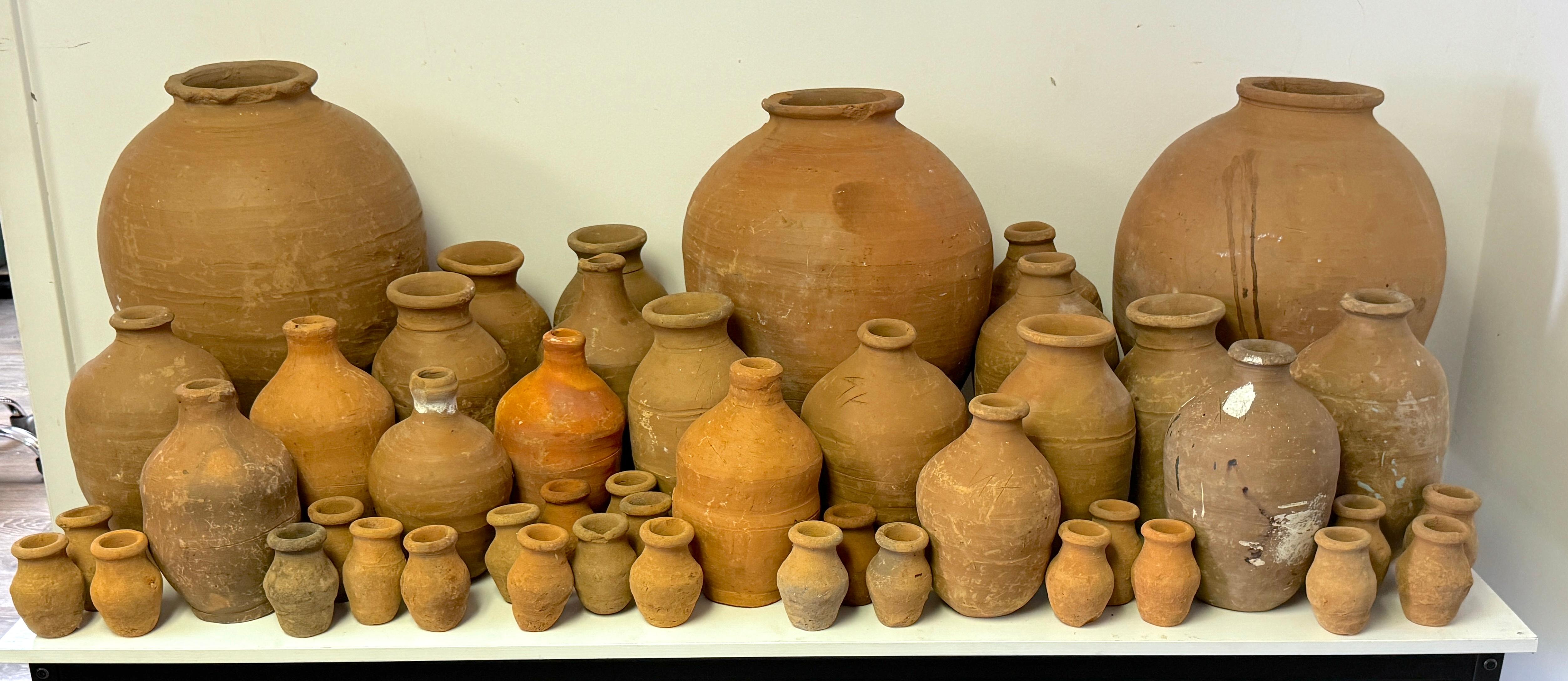 Collection of 46 Spanish Colonial Hand-Thrown Terracotta Vessels, Late 19th–Early 20th Century

A rare and visually striking assembled collection of forty-six Spanish Colonial–style hand-thrown terracotta vessels in graduated sizes, dating from the