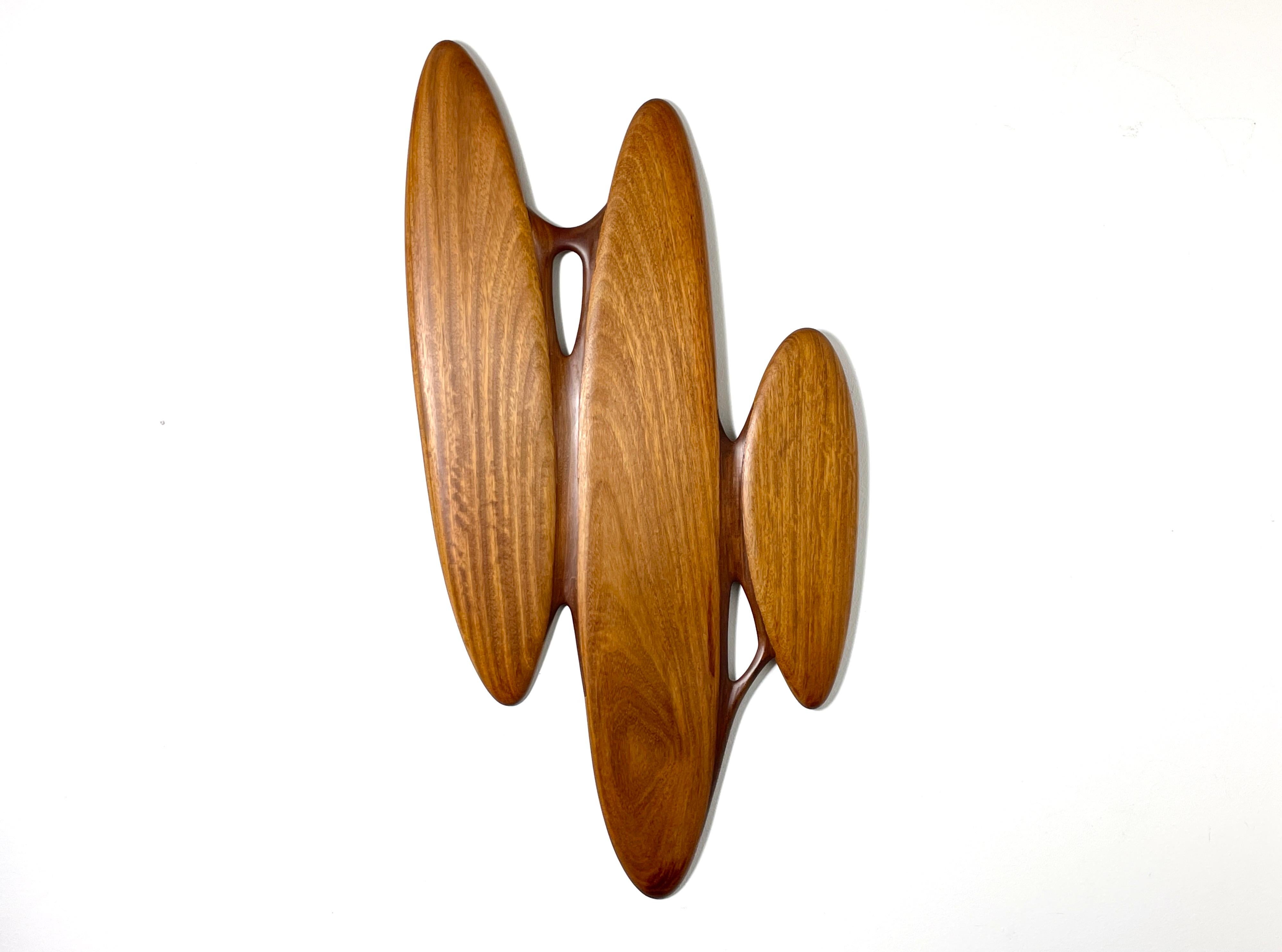 Vintage biomorphic American studio craft abstract wall sculpture
Modernist piece comprised of three oblong teak segments with sculpted joinery
Signed and dated A Boone 1982
