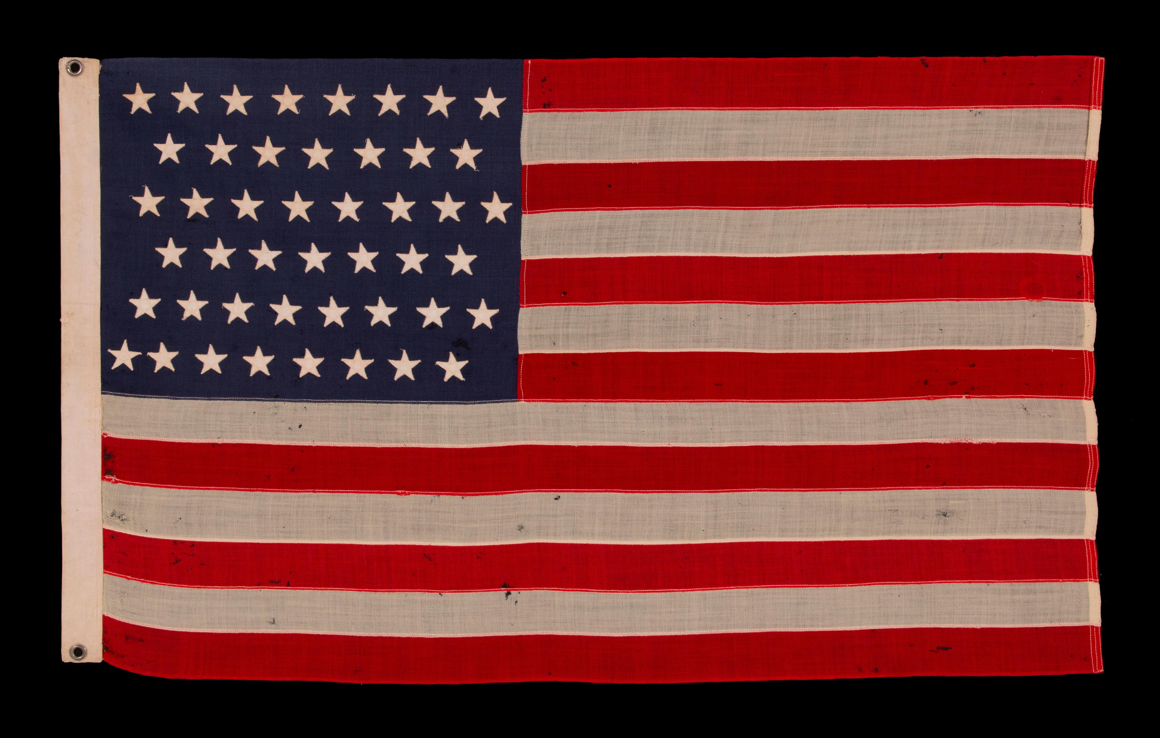 46 star antique American flag in an exceptionally small scale among its pieced-and-sewn counterparts, reflects oklahoma statehood, circa 1907-1912:

46 star American national flag in a tiny and very rare scale among its counterparts of the period