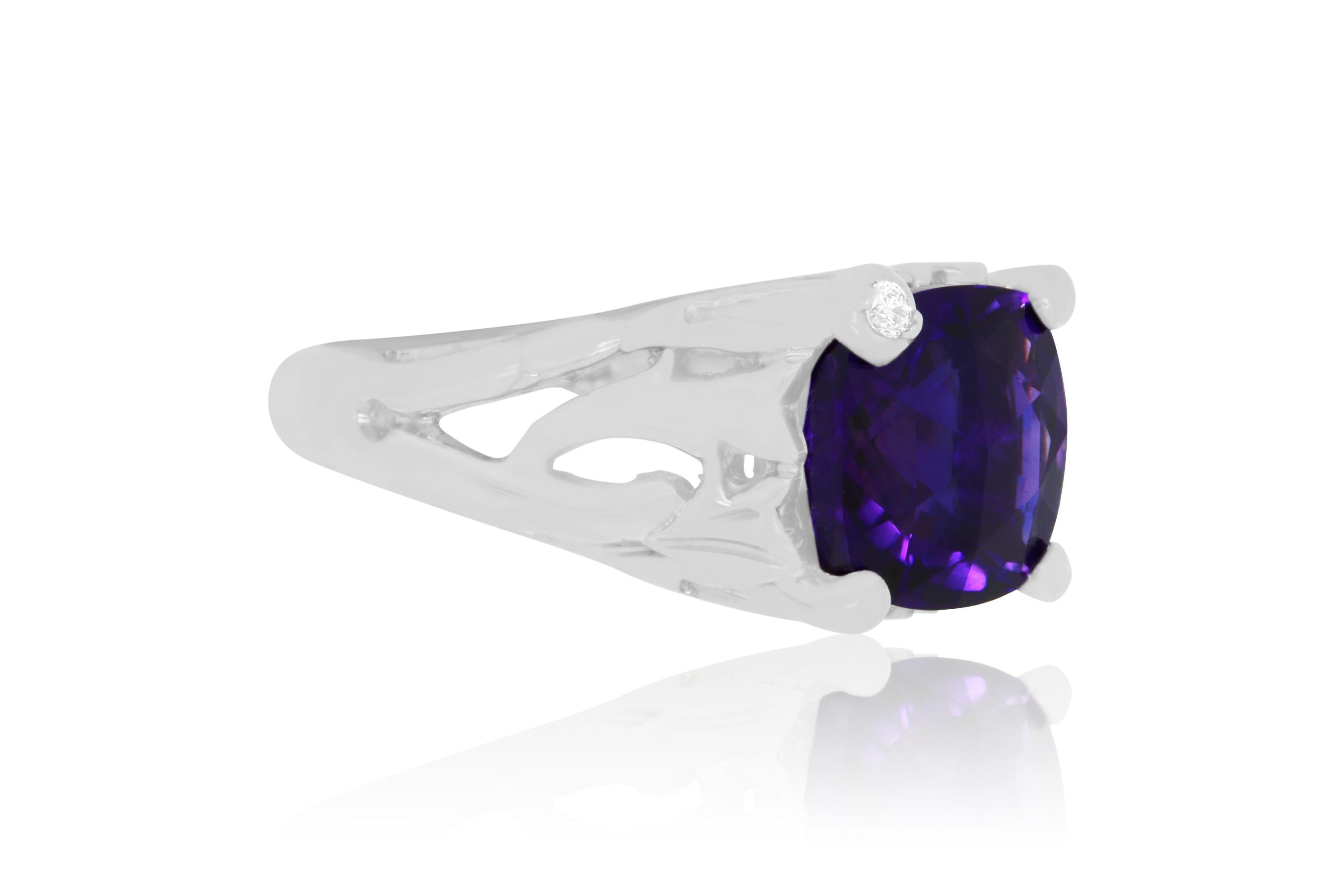 This beautiful and bold piece features a 4.60 Carat Amethyst stone encased in 14K white gold and adorned with a single brilliant round white diamond.

Material: 14k White Gold 
Stone Details: 1 Cushion Cut Amethyst at 4.60 Carats
Mounting Stone