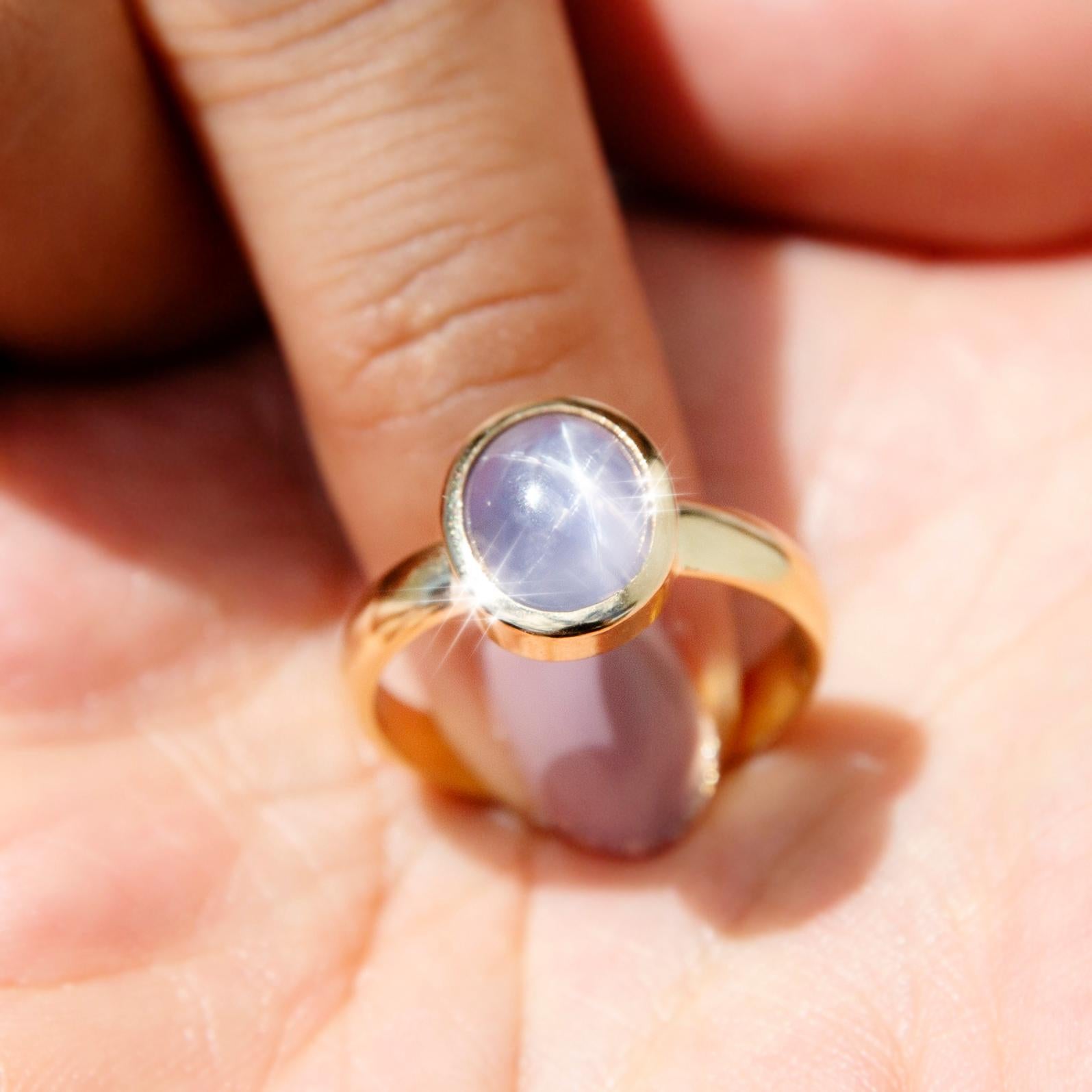 Oval Cut 4.60 Carat Blue Ceylon Star Sapphire Cabochon Solitaire Ring 18 Carat Gold For Sale
