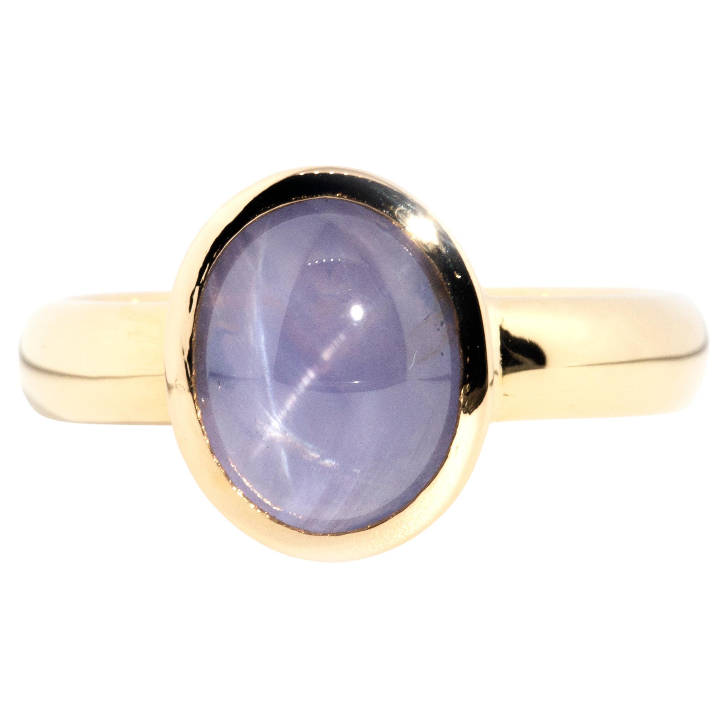 Bague solitaire en or 18 carats avec saphir étoilé bleu de Ceylan cabochon de 4,60 carats en vente