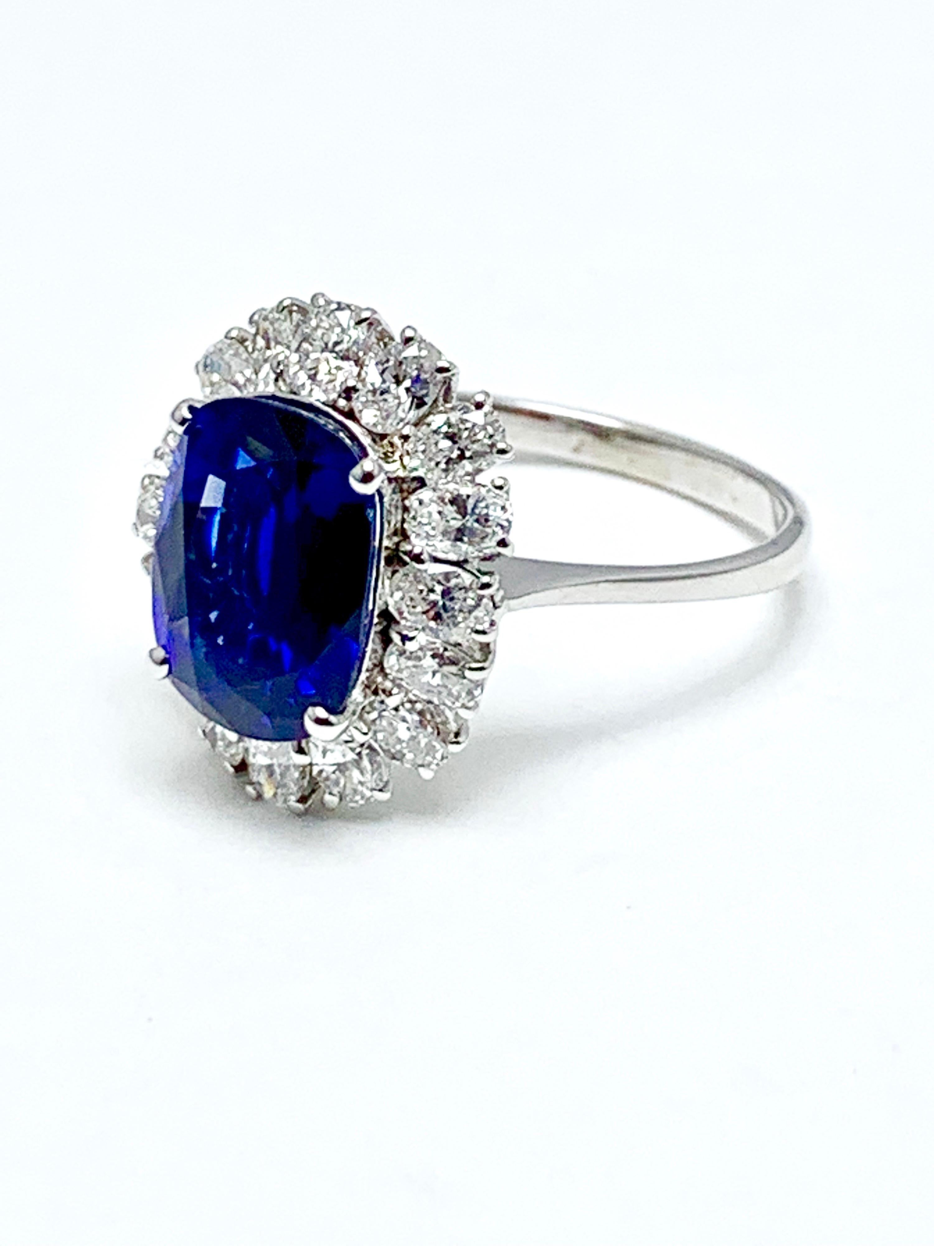 Modern 4.60 Carat Cushion Cut Sapphire and Oval Diamond Halo White Gold Cocktail Ring For Sale