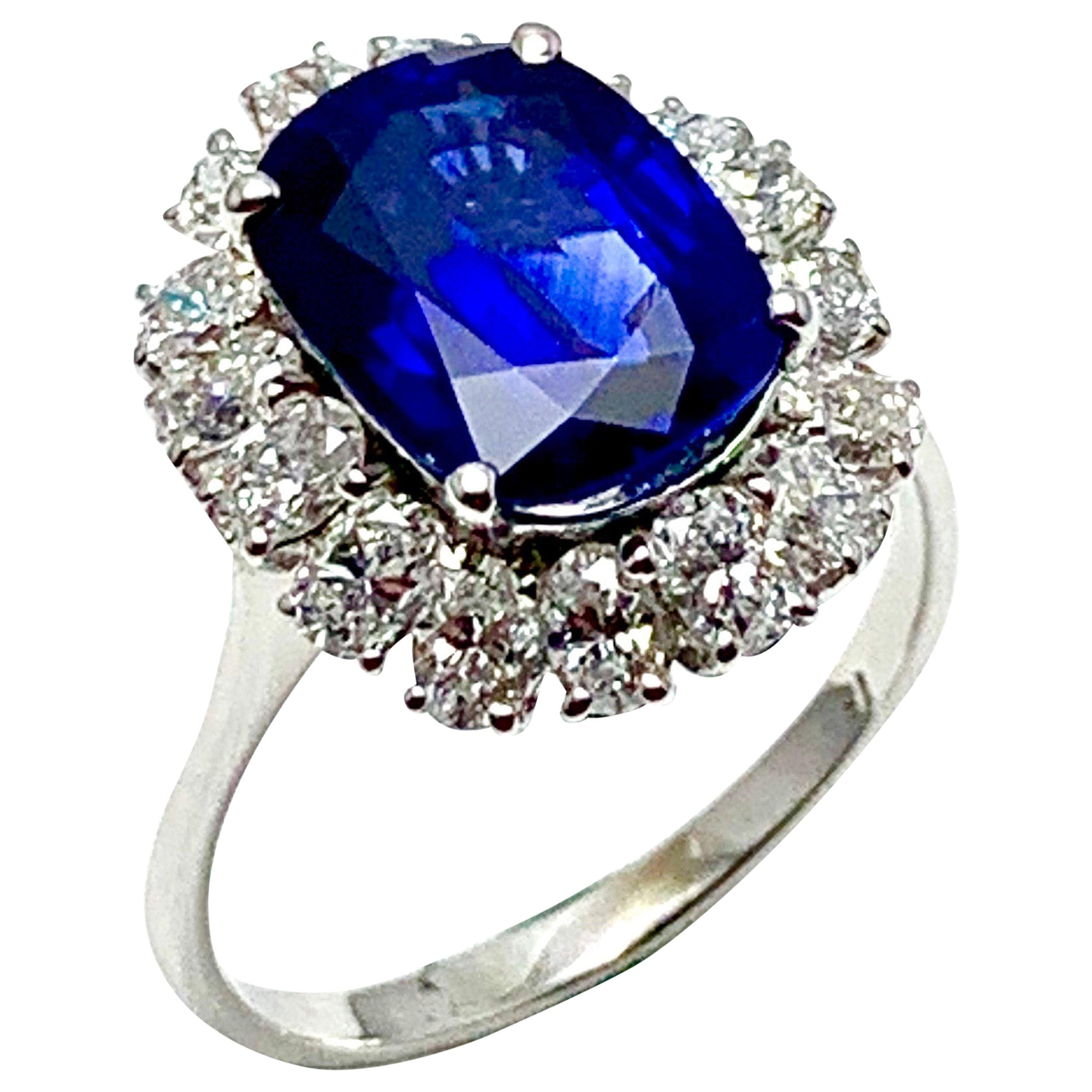 4.60 Carat Cushion Cut Sapphire and Oval Diamond Halo White Gold Cocktail Ring For Sale