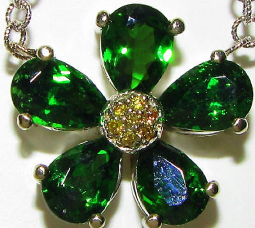 4.40ct. Natural tsavorites

Excellent cuts, clean clarity.

Vivid green

&

.20ct. natural yellow diamonds

14kt. white gold.

7.8 grams.

18.10mm in diameter

16.25 inches long



$6500 appraisal to accompany