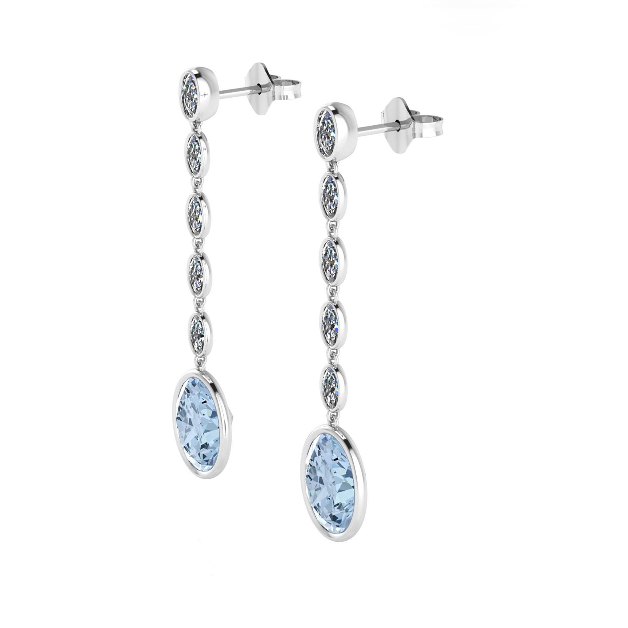 These approximate 4.60 carat Oval, natural Aquamarine, ethically sourced and mined in Brazil, and white, bright Oval cut diamonds for an approximate 1.10 carat weight, set in thin, minimalist bezels in 18k white gold, to enhance the light of the