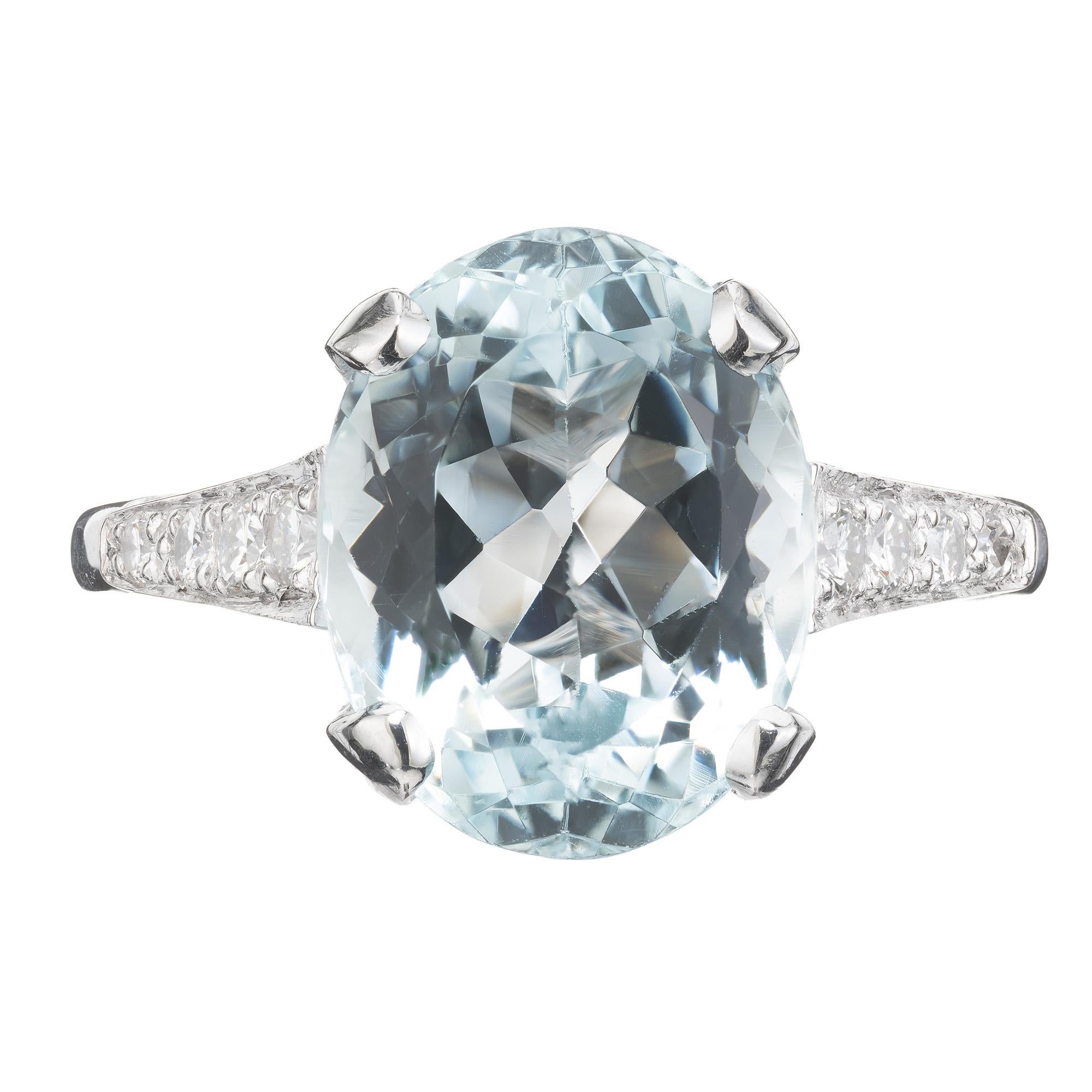 Fantastic 1960's very bright soft blue natural aquamarine and diamond engagement ring. 4.60cts oval aqua mounted in a platinum setting, accented with 4 round brilliant cut diamonds along each shoulder. The ring is classic and elegant, suitable for