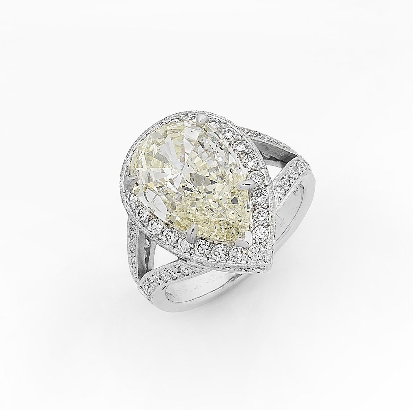 Created and handmade in 18 karat white gold. The elegant Halo style diamond cluster ring is centered with one pear shape diamond surrounded by eighty three milligrain set brilliant cut diamonds.
Diamonds
1=4.60ct pear shape- Auscert (Australian