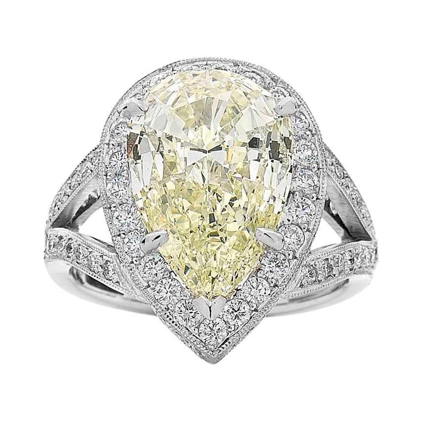 4.60 Carat Pear Shape Yellow Diamond Halo Engagement Ring For Sale