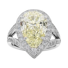 4.60 Carat Pear Shape Yellow Diamond Halo Engagement Ring