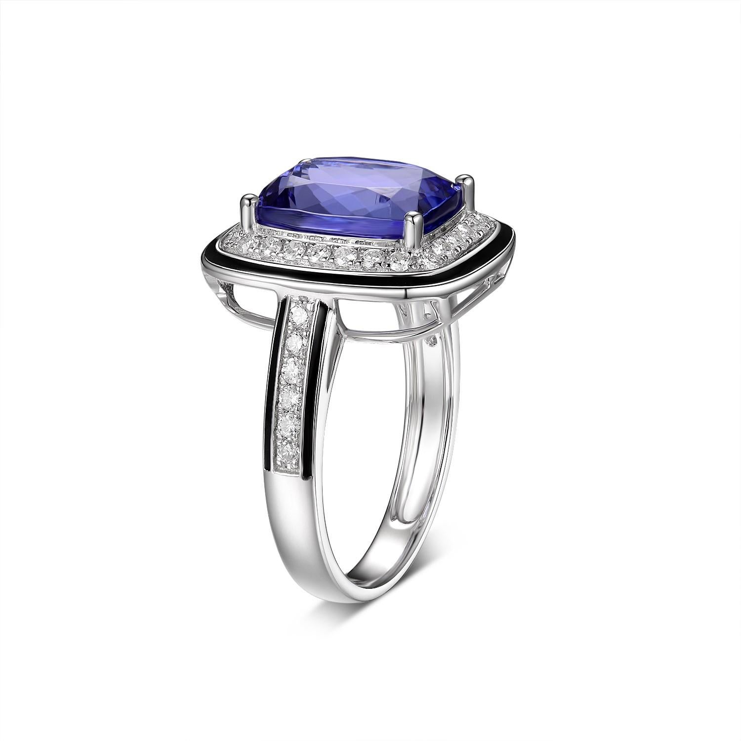 This stunning piece features 4.60 carats of cushion tanzanite in the center. The main stone is assented with a diamond halo then outlined with black enamel. A classic yet modern design. 

US 6.5
Tanzanite 4.60 carat
Diamond 0.37 carat
Black Enamel