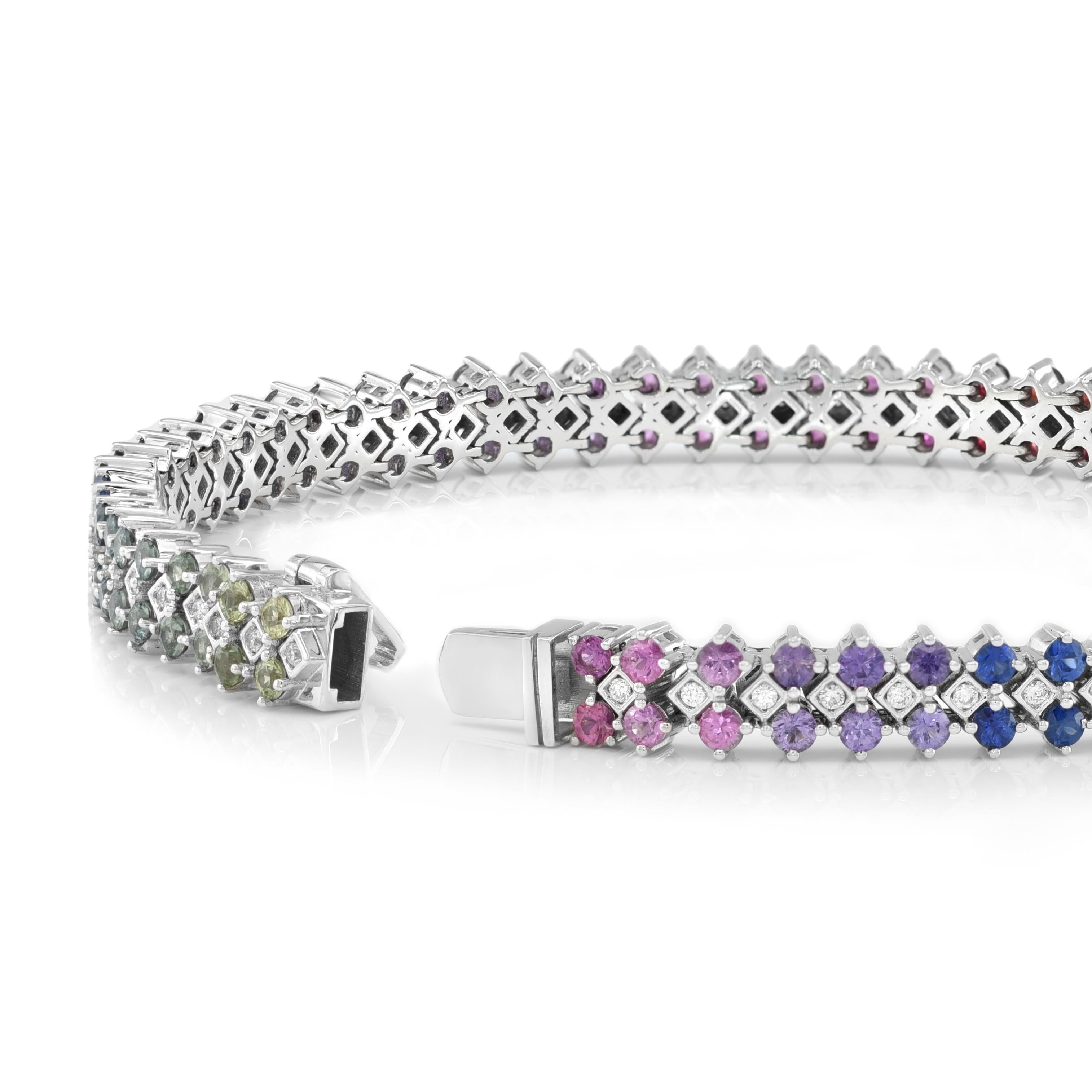 Elevate your style with a masterpiece: 4.60 carats Natural Rainbow Multi Color Sapphires and 0.33 carats Diamonds ensemble, elegantly set in an 18K White Gold Bracelet measuring 7 inches in length. The brilliance of Sri Lanka's Brilliant cut