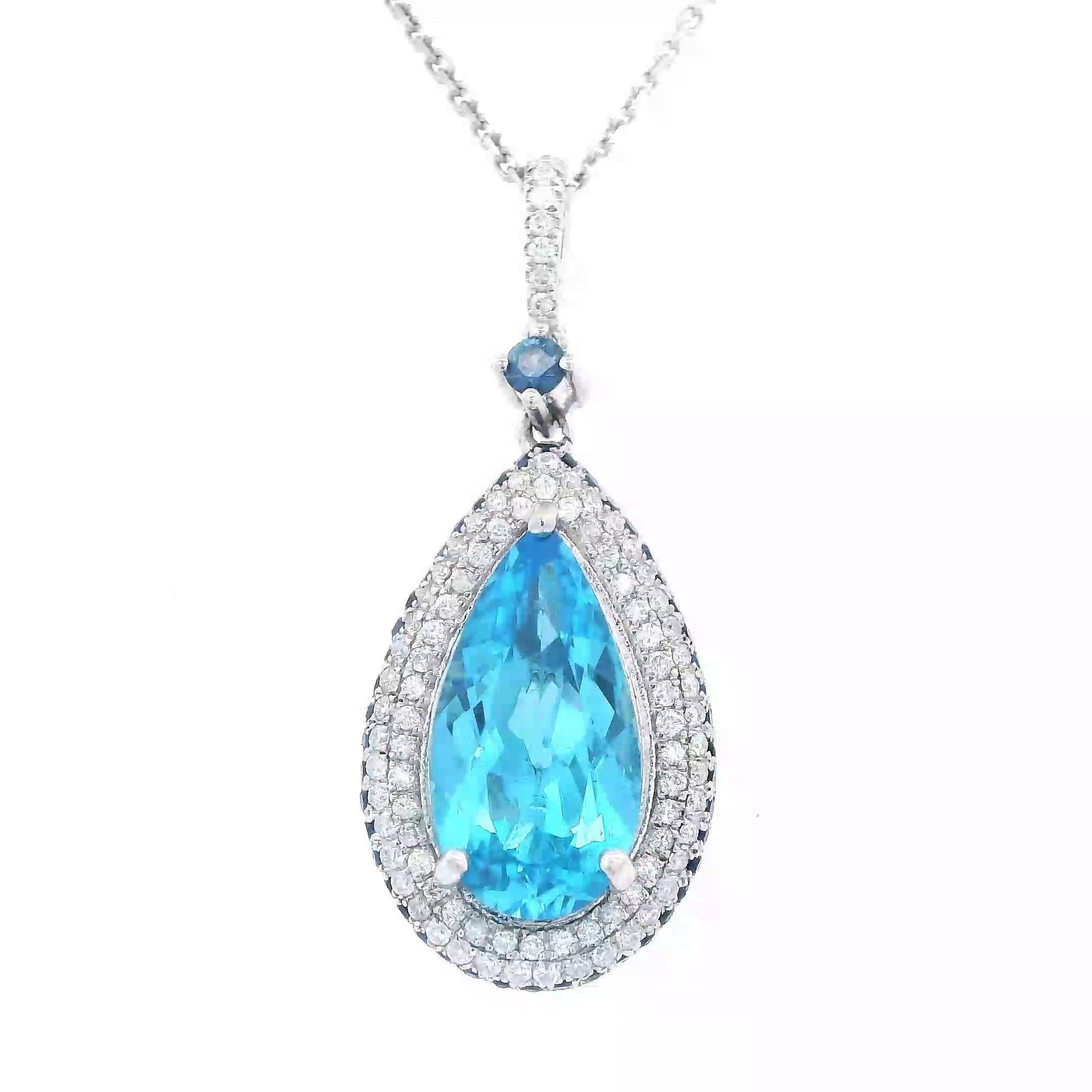 Stunning electric blue topaz pendant necklace.
5.40 carats total gemstone weight.
4.60 carat pear blue topaz. 89 round brilliant diamonds, 0.45 carats. Approximately G color and VS2 clarity. 47 round sapphires, heat, 0.35 carats. 14-karat white