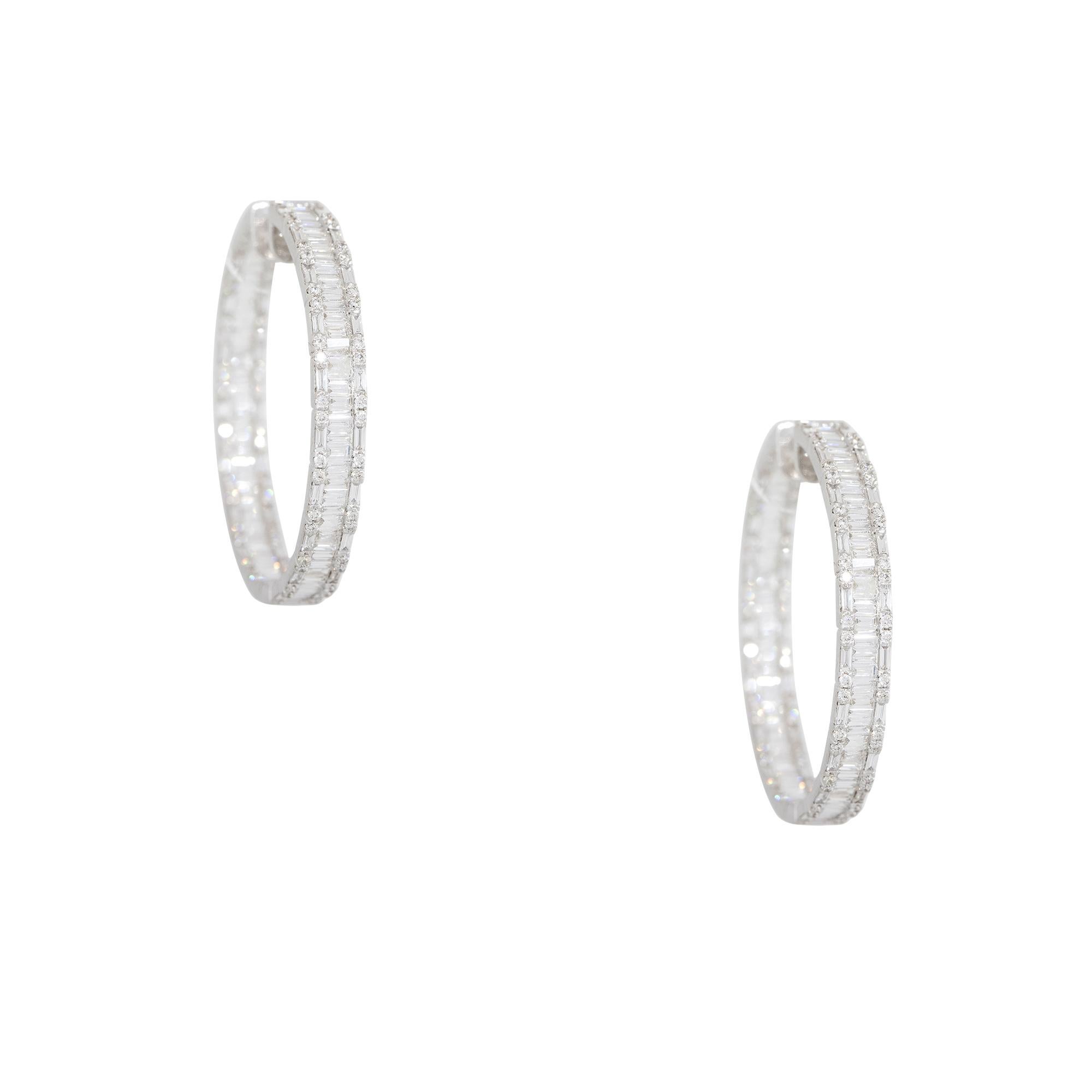 18k White Gold 4.61ctw Diamond Multi-Shape Hoop Earrings

Product: Baguette & Round Brilliant Diamond Hoop Earrings
Material: 18k White Gold
Diamond Details: There are approximately 1.05 carats of Round Brilliant cut diamonds (144 stones) and
