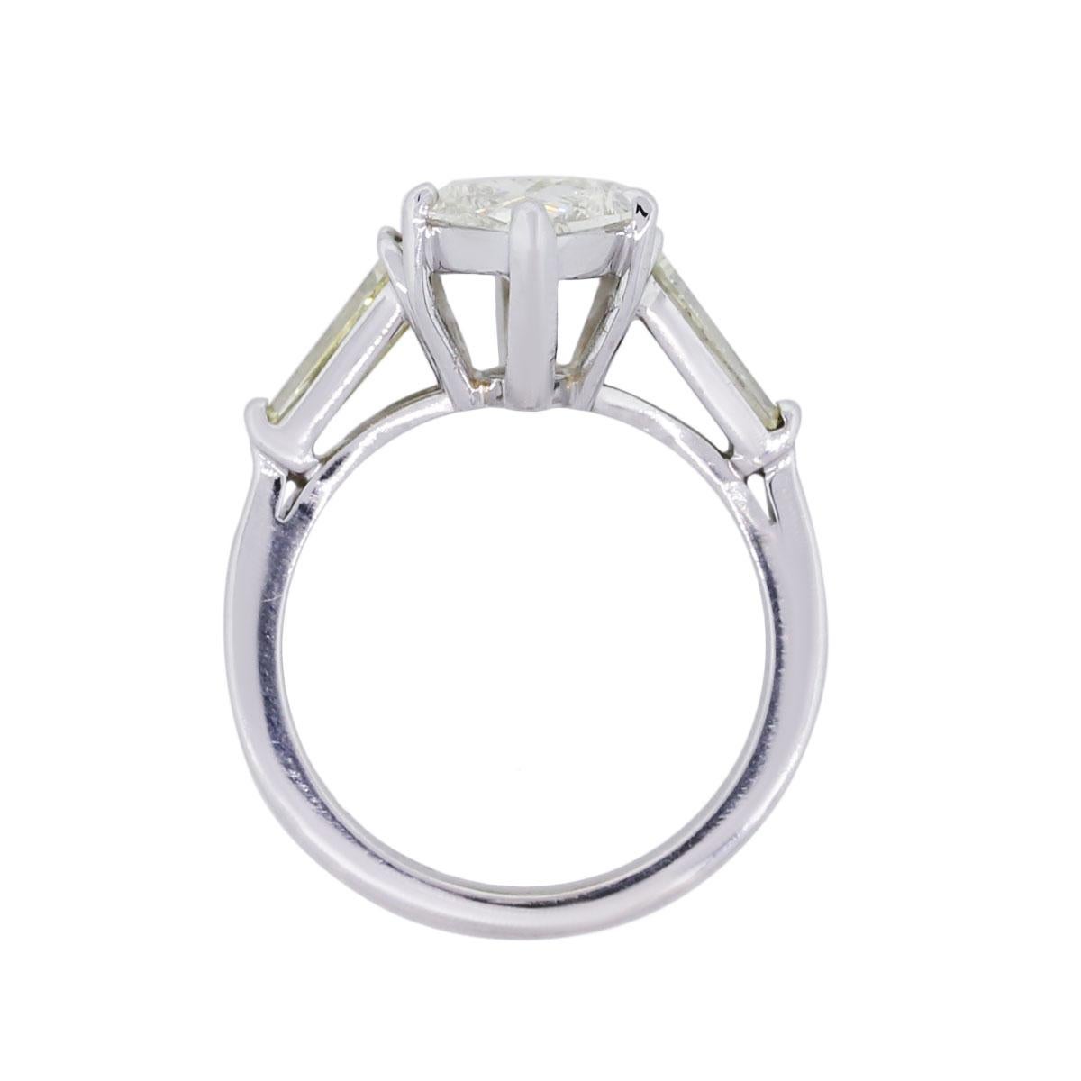 Material: Platinum
Main Diamond Details: Marquise shape diamond approximately 4.61ct. Diamond is K in color and SI2 in clarity.
Adjacent Diamond Details: 2 baguette shape diamonds measuring approximately 7.87mm x 4.09mm each
Ring Size: 7.25 (can be