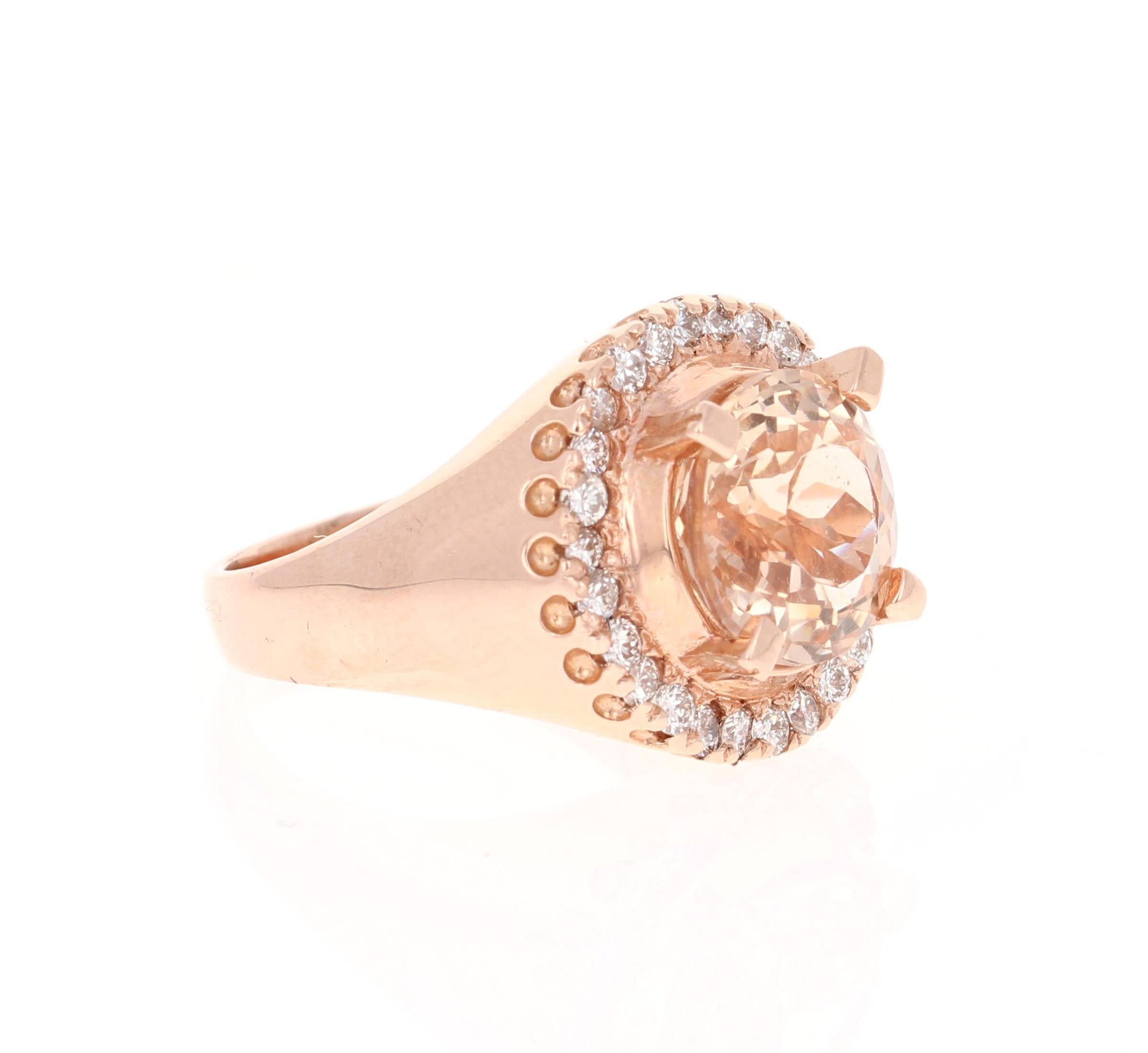 Statement Morganite Diamond Ring! 

This Morganite ring has a 3.96 Carat Round Cut Morganite and is surrounded by 26 Round Cut Diamonds that weigh 0.65 Carats. The total carat weight of the ring is 4.61 Carats.  

The Morganite is 11 mm and the face