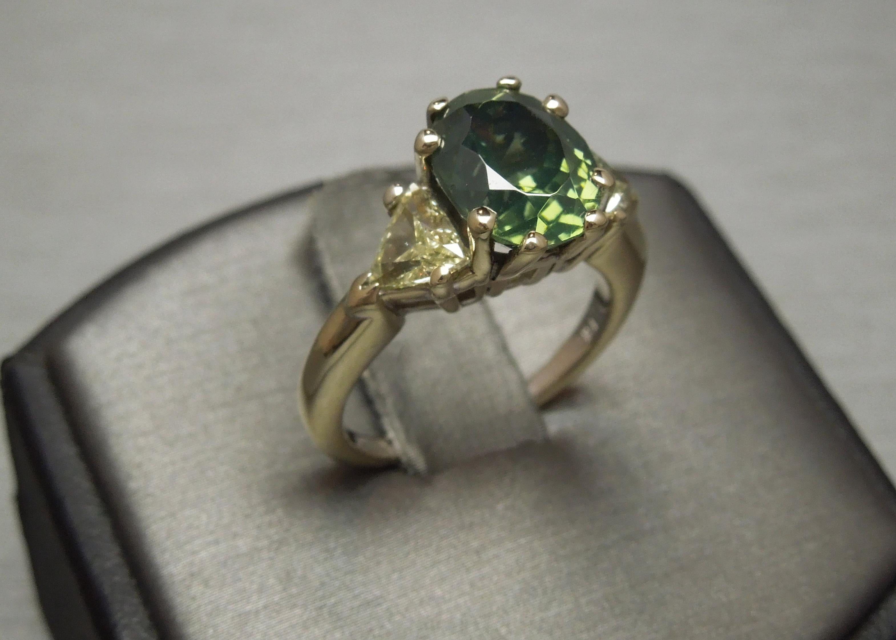 Women's 4.61 Carat Oval Green GIA Zircon and Trillion Cut Diamond Three-Stone Ring For Sale