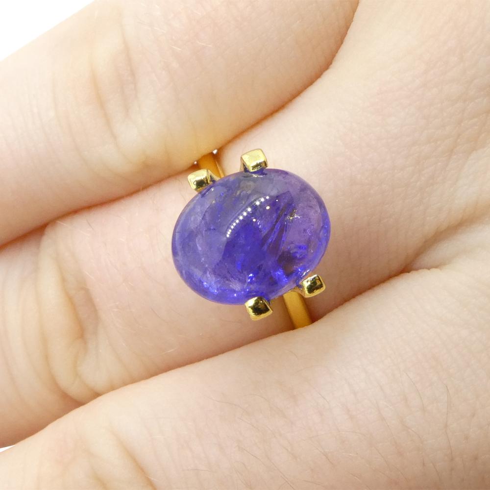Description:

Gem Type: Tanzanite 
Number of Stones: 1
Weight: 4.61 cts
Measurements: 11.04 x 8.87 x 5.74 mm mm
Shape: Oval Sugarloaf Double Cabochon
Cutting Style Crown: 
Cutting Style Pavilion:  
Transparency: Transparent
Clarity: Moderately