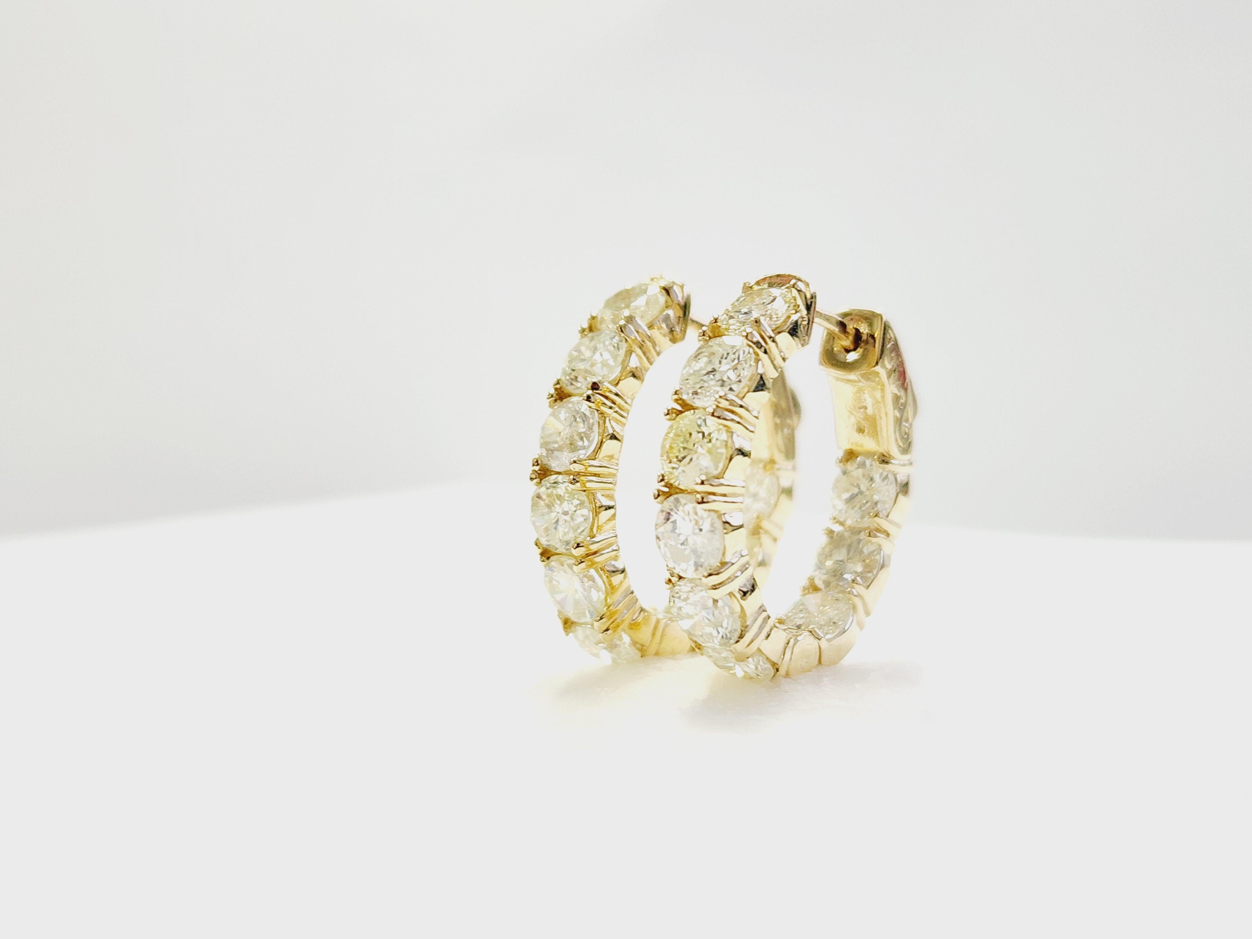 These beautiful natural diamond inside-out hoop earrings are crafted in 14k yellow gold, offering a timeless and elegant design. Featuring diamonds that encircle the hoop, they shine from both the inside and outside, enhancing the sparkle and