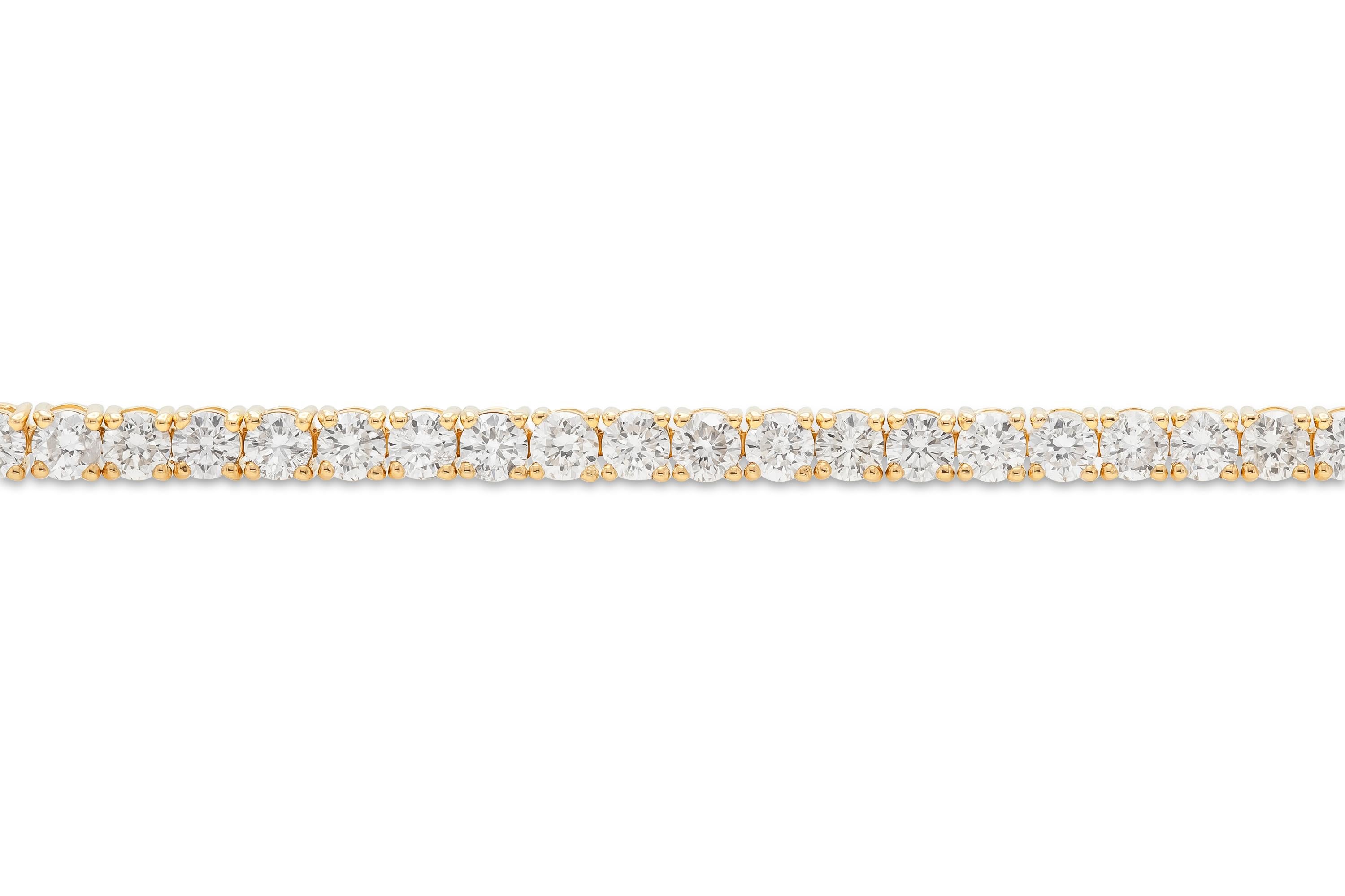 Finely crafted in 14k yellow gold with 64 round brilliant cut diamonds weighing a total of 4.62 carats.
4 prong-set.
7 inches long