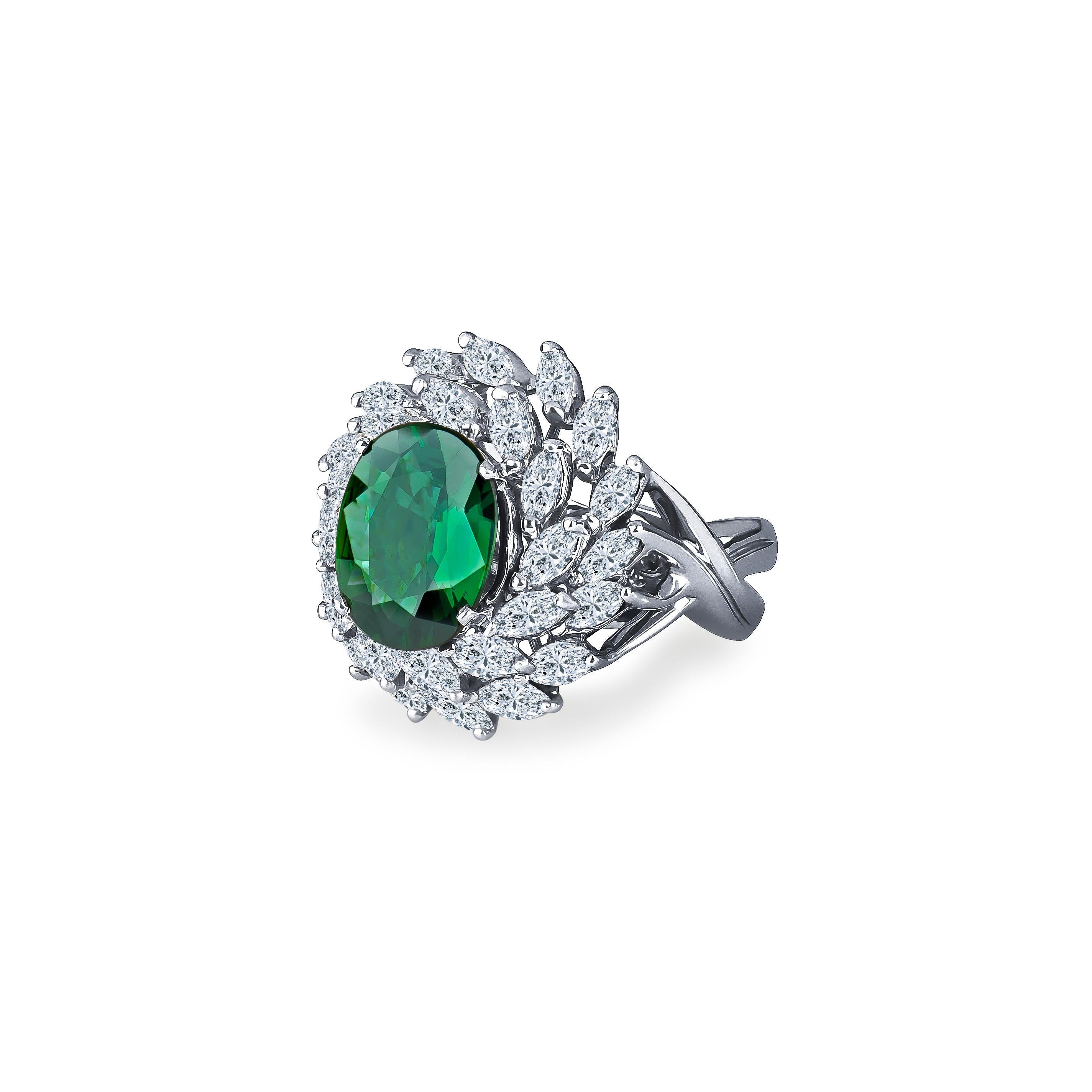 This amazing cocktail ring features a 4.62 carat oval, step cut green sapphire surrounded by 2.75 total carats of marquise diamonds set in platinum. This ring is currently a size 6 but can be resized upon request. 
Sapphire Measurements: