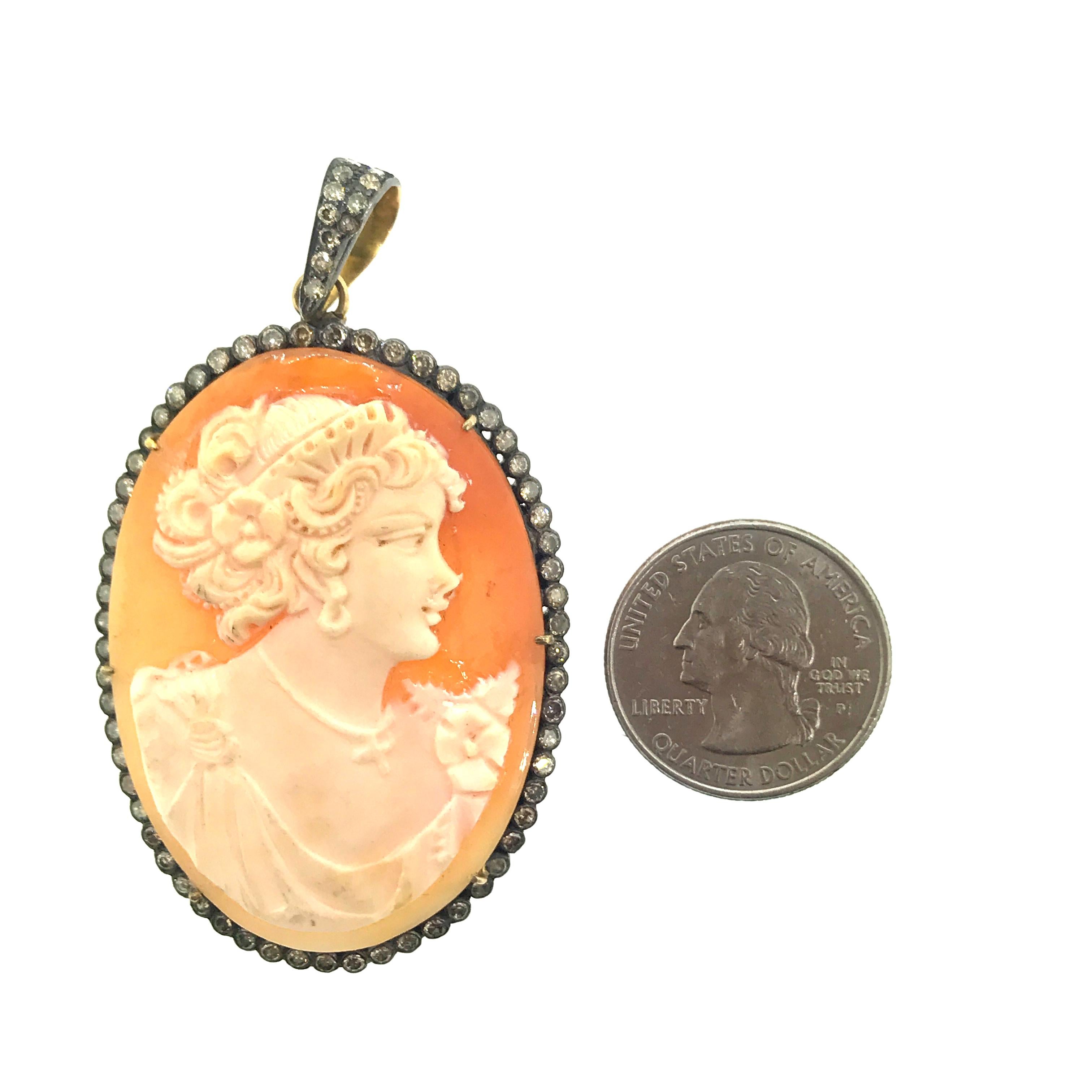 This lady in real Italian cameo shell carved in Italy surrounded by 2.06 ct champagne diamonds is set in oxidized sterling silver  with the back of the bail in 14KT Gold has been made in India.The jump ring attaching the cameo shell and the bail is
