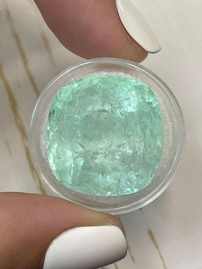 Stone: Emerald
Weight: 46.22-carats
Shape: Cushion Cut
Clarity: Semi-Transparent
Luster: Good
Color: Light Green
Measurements: 22.15mm x 21.34mm x 16.42mm
Geographic Origin: Colombia
Treatment: Natural, Oiling

Comments: Due to their growth