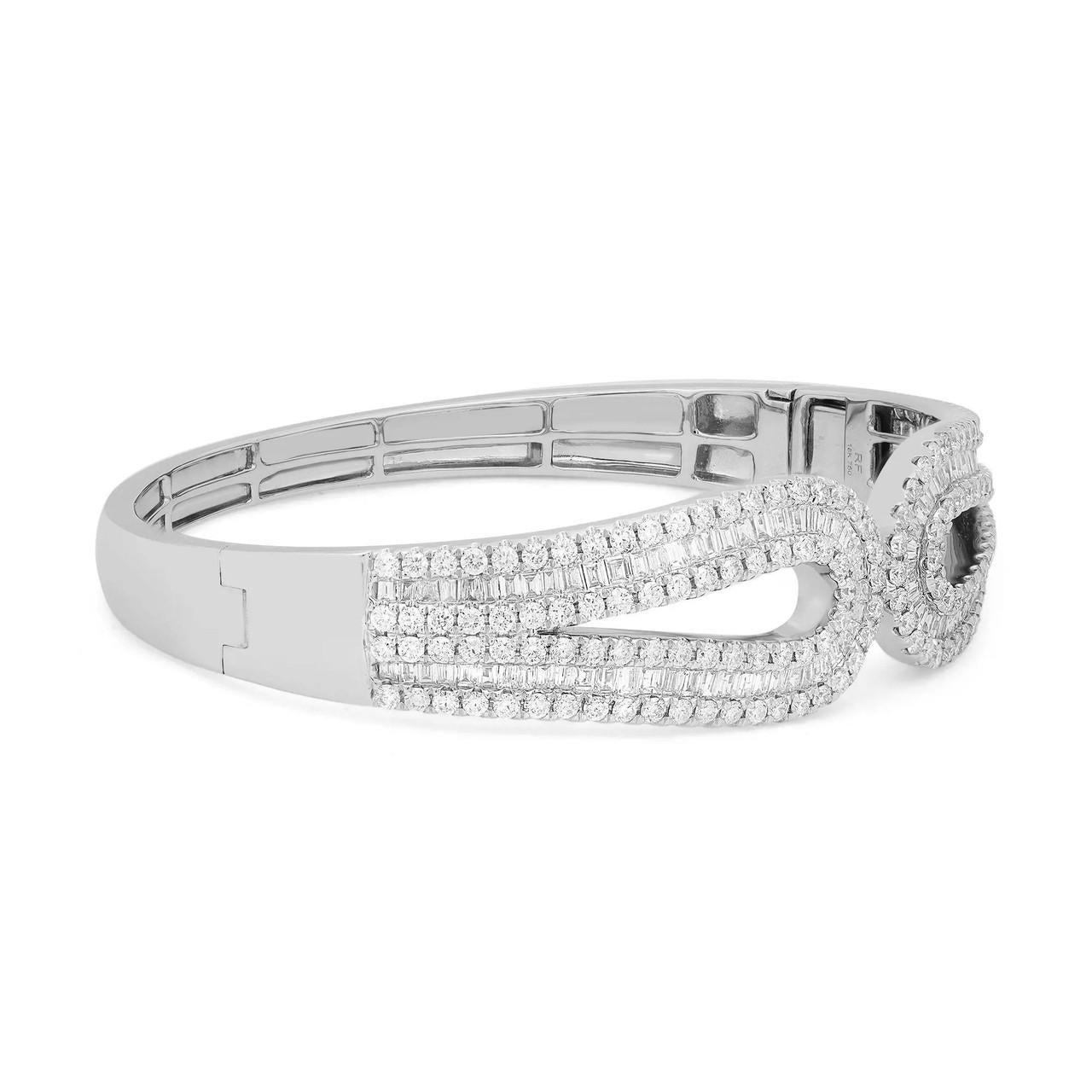 Introducing the captivating 4.63 Carat Baguette and Round Diamond Bracelet in 18k White Gold. This bracelet showcases a band of endless shimmer, created by the precise setting of slim diamond baguettes. The baguettes form a slim and elegant design