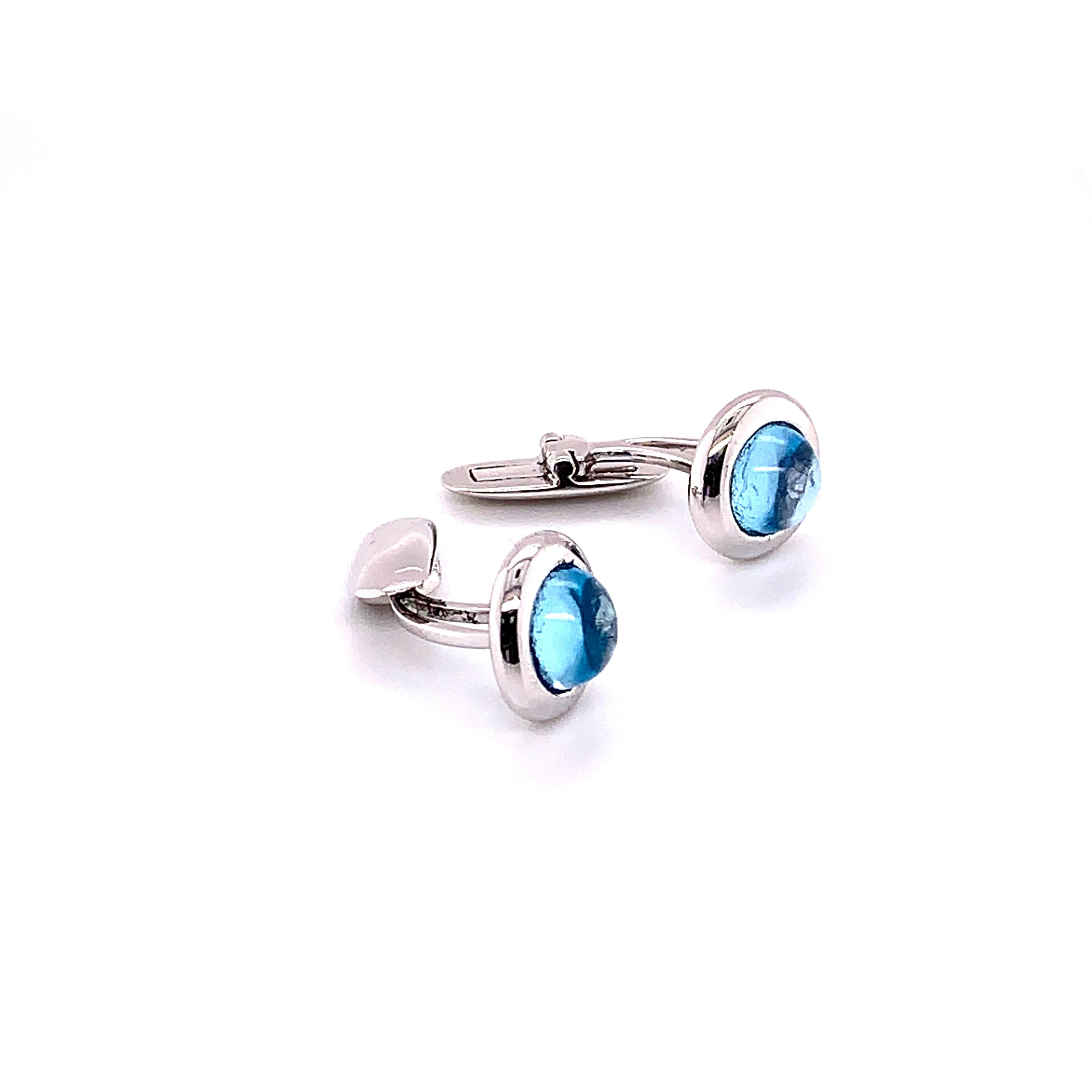 The richness of the blue Topaz is highlighted in these stunning cuff links. Each cuff link comprising a 4.63 carat topaz stone. This Cuff link featuring 18K White Gold and weighing 7.81 grams.

Color stone and Gold breakdown:
Topaz - 4.63 Carat
Gold