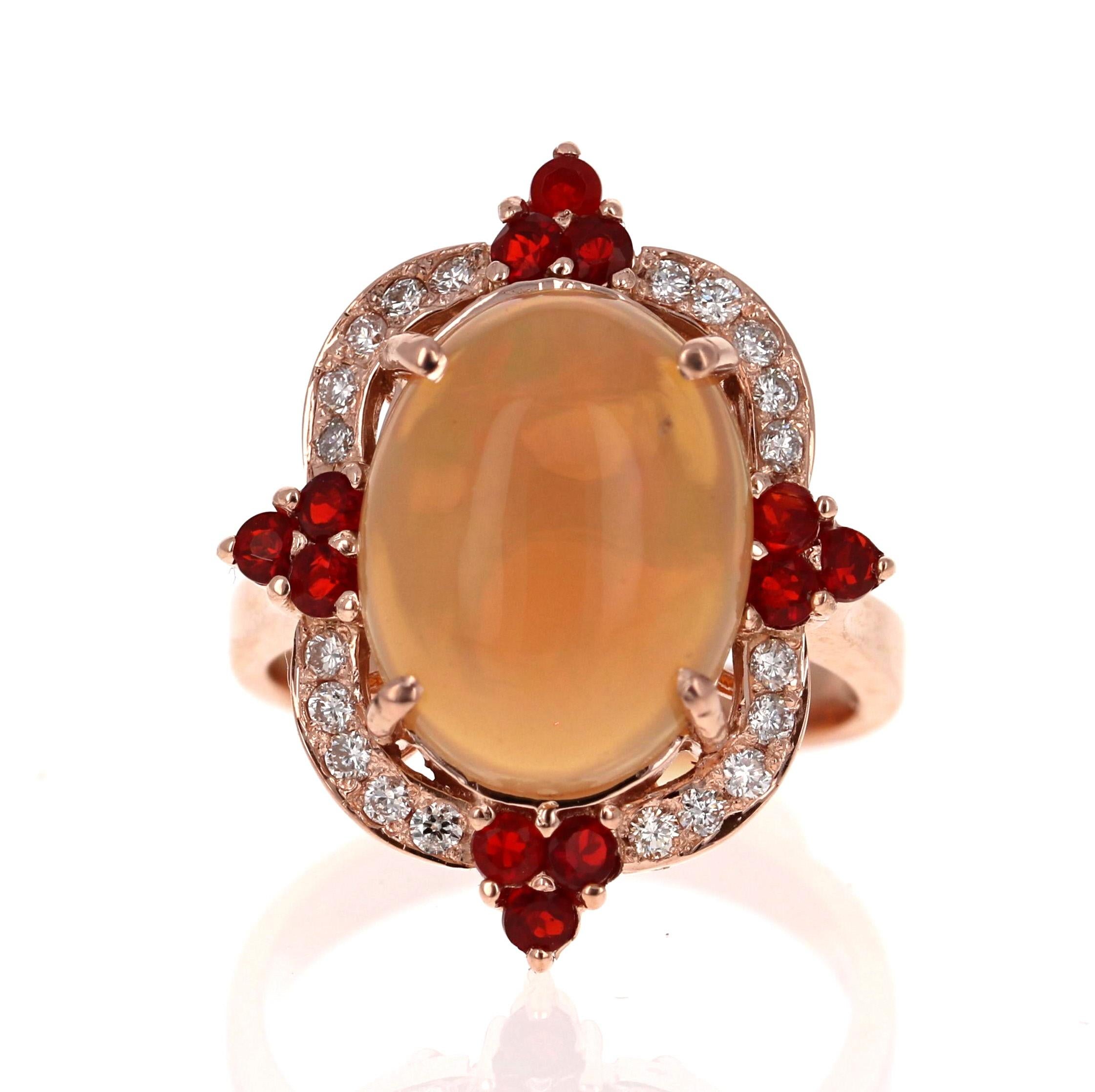 Stunning and uniquely designed 6.63 Carat Oval Cut Opal Diamond Rose Gold Ring with Fire Opal accents!

The Oval Cut Opal in the center of the ring weighs 3.87 carats.  It is surrounded by 20 Round Cut Diamonds that weigh 0.30 carats (Clarity: SI2,