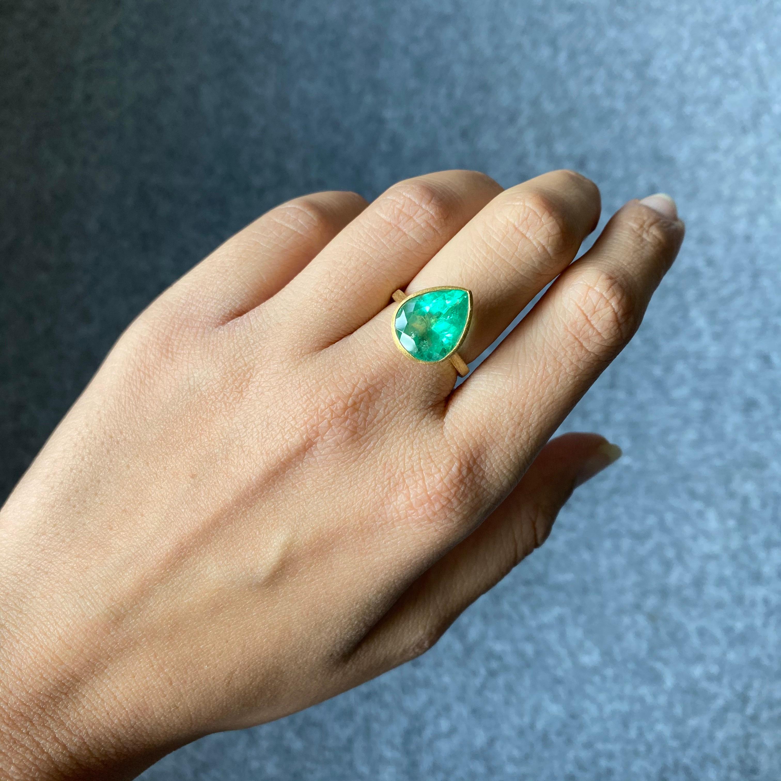 A simple, and classic single stone ring - with a 4.63 carat, natural (not treated/dyed) pear shape Colombian Emerald centre stone set in 4.4 grams of matte finish 18K Yellow Gold. The stone has great luster to it, and an ideal color. Currently sized