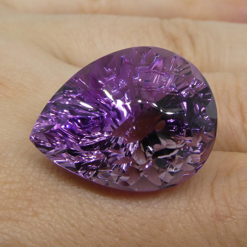 Description:

Gem Type: Amethyst 
Number of Stones: 1
Weight: 46.3 cts
Measurements: 26x19x18mm
Shape: Pear
Cutting Style: Pear Fantasy Cut
Cutting Style Crown: Fantasy Cut
Cutting Style Pavilion: Fantasy Cut 
Transparency: Transparent
Clarity: Very