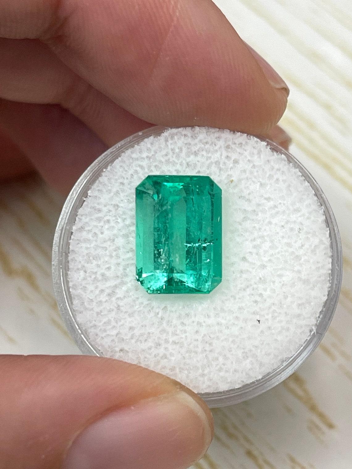 Stone: Emerald
Weight: 4.63-carats
Shape: Emerald Cut
Clarity: Semi-Transparent
Luster: Very Good
Color: Medium Green
Measurements: 11.80mm x 8.62mm x 6.19mm
Geographic Origin: Colombia
Treatment: Natural, Oiling

Comments: Due to their growth