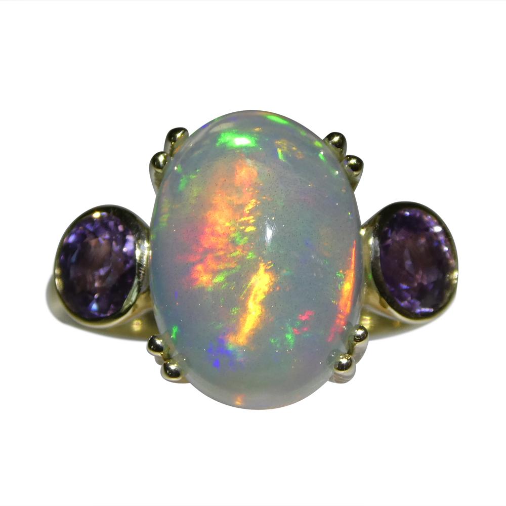 Step into a world of colour and charm with our 4.63ct Opal & Sapphire Cocktail Ring set in 14K Yellow Gold. The opalescent shimmer of the opal, complemented by the rich sapphires, weaves a captivating story of love's many splendours.


At Skyjems,