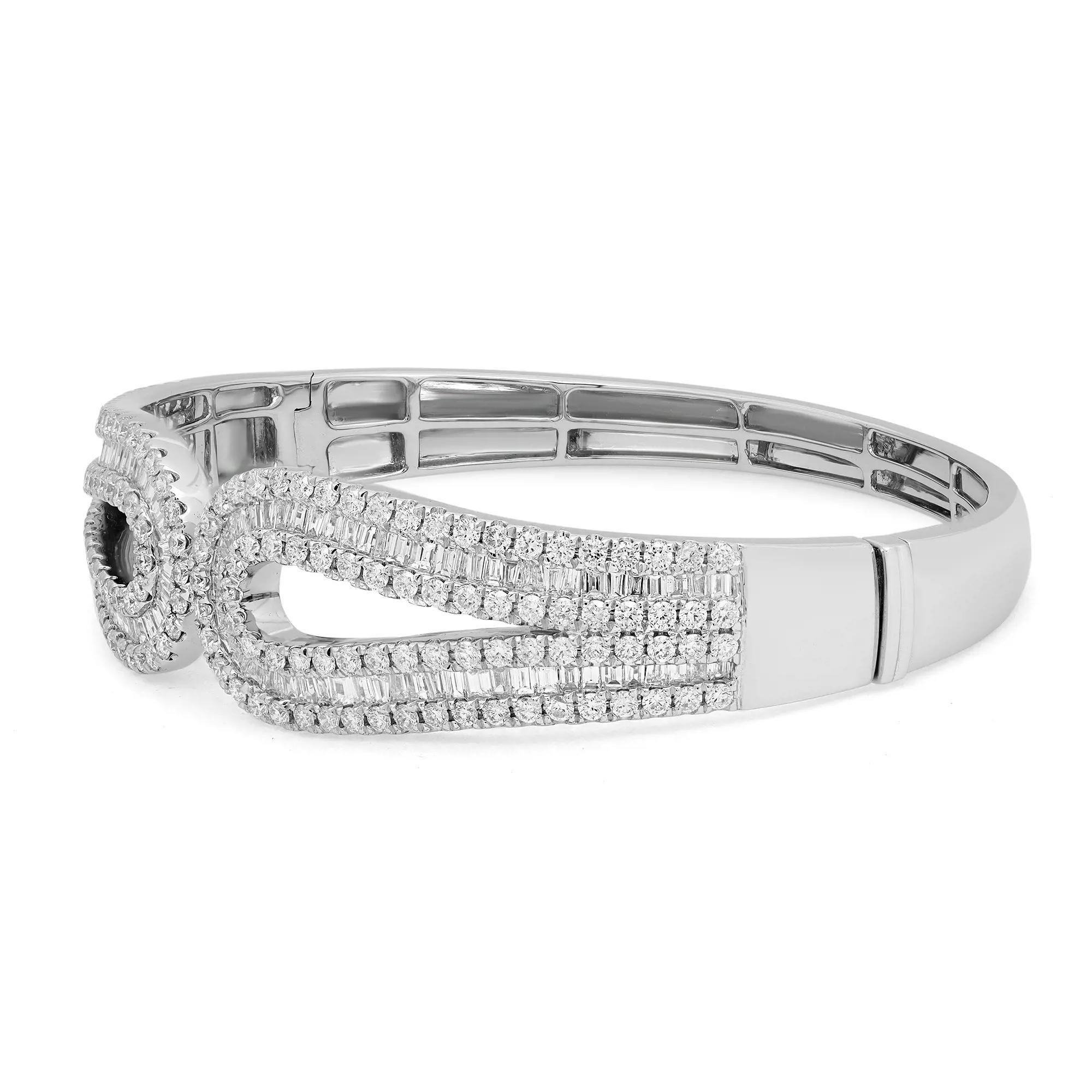 This beautifully crafted bangle bracelet features channel set baguette cut diamonds with an outline of prong set round brilliant cut diamonds. Crafted in 18K white gold. Total diamond weight: 4.63 carats. Diamond Quality: G-H color and VS-SI