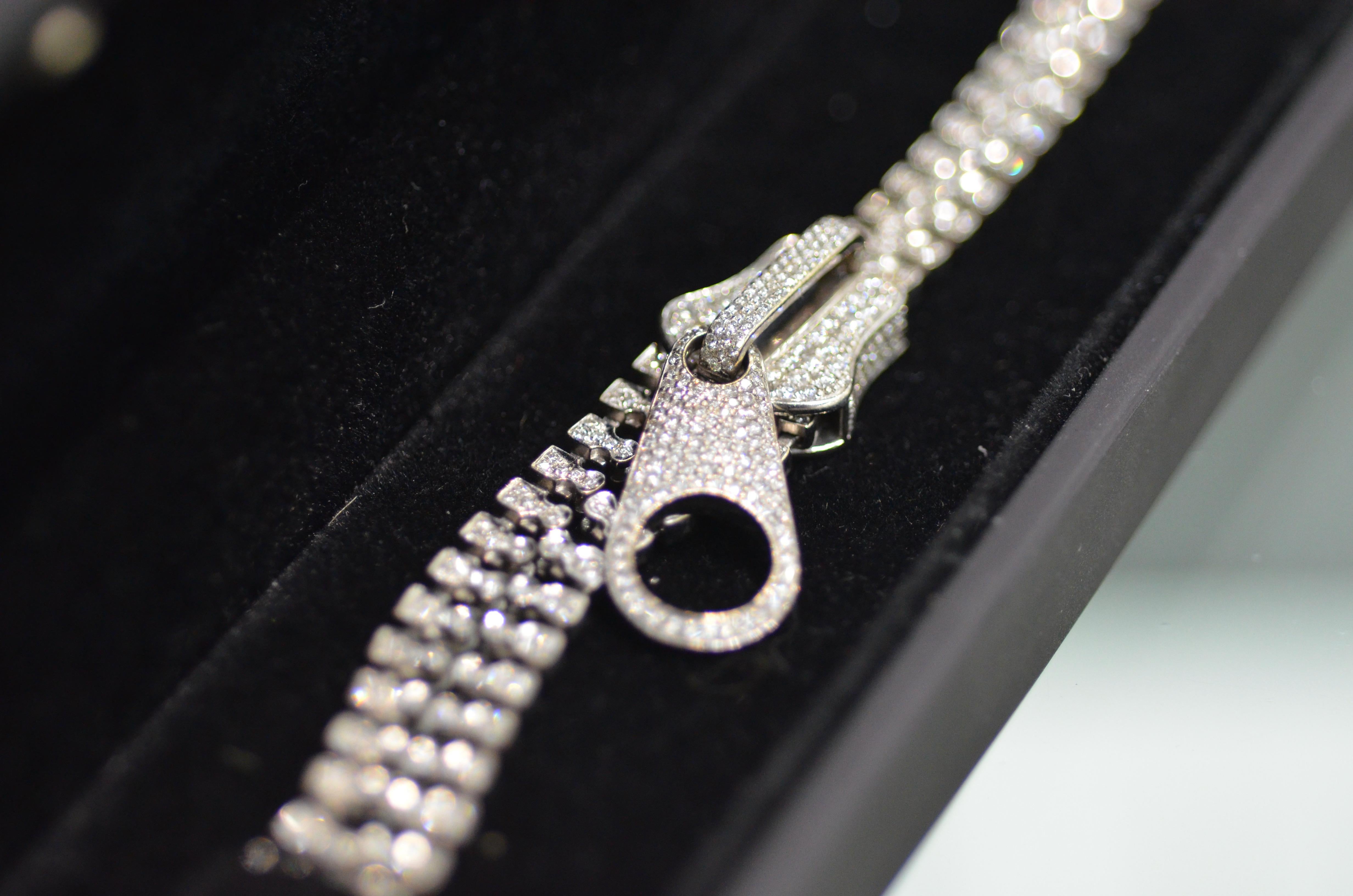 This stunning zipper bracelet has 4.63 carats of diamonds set in 18k white gold. The truly unique design allows you to zip and unzip the bracelet so it can be worn as a single bracelet or give the illusion of two. 

Manufacturer description: 