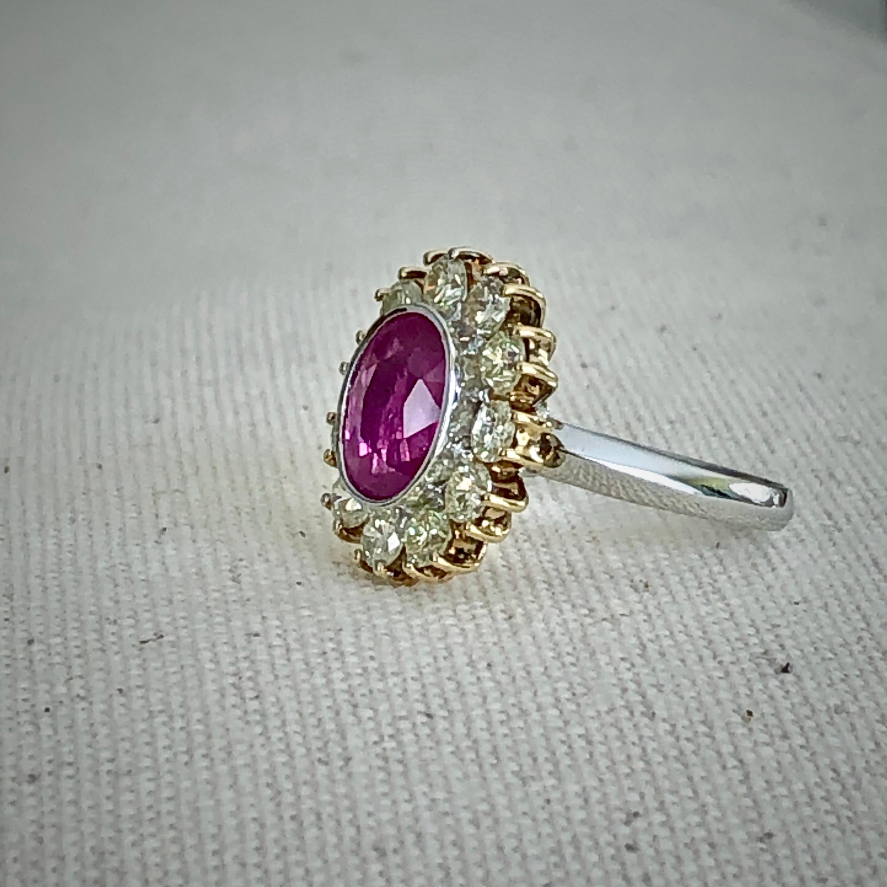 A beautiful ring comprising a scarce 3.10 carat oval bubble gum pink sapphire and 1.54 carats of round diamonds around it. 
Primary Stones: Stunning Natural Sapphire
Shape or Cut: Oval Cut
Average Color/Clarity: Hot Pink/ Clarity VS
Total Sapphire