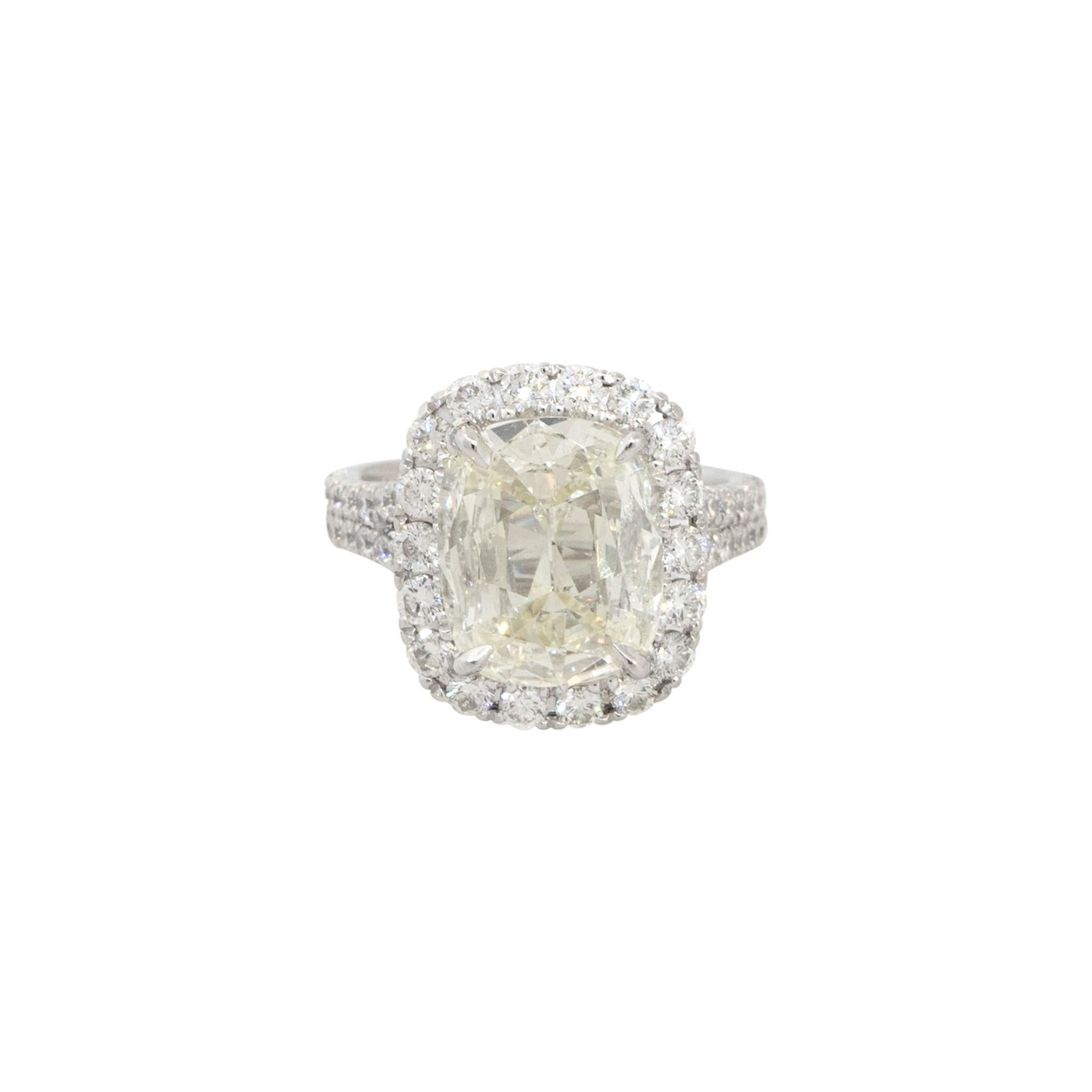 Platinum 4.64ctw Cushion Cut Diamond Halo Engagement Ring
Material: Platinum
Diamond Details: Approx. 3.59ctw Cushion Cut Diamond. Center Diamond is L in color and SI1 in clarity
Mounting Details: Approx. 1.05ctw of Round Brilliant Cut Diamonds.
