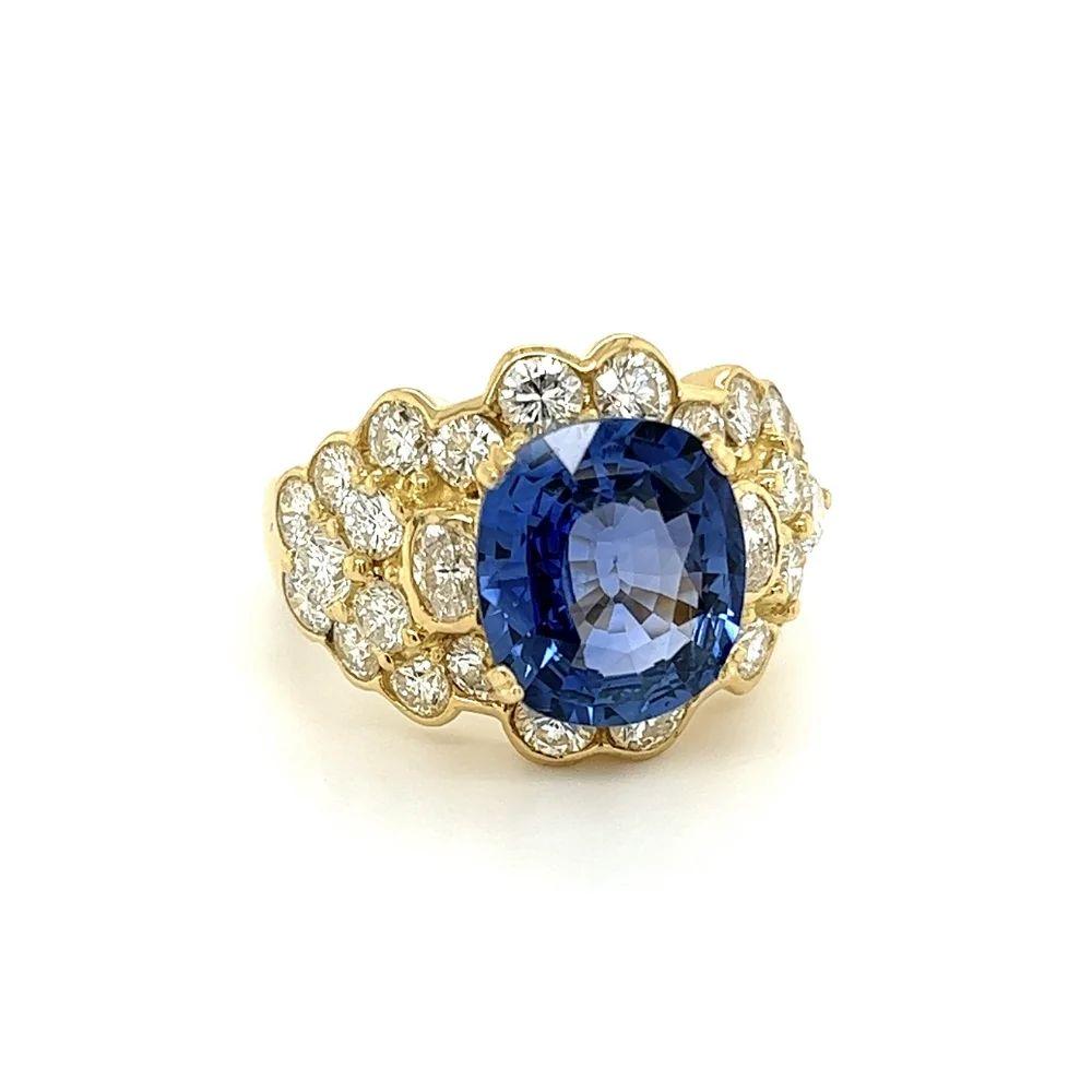 Simply Beautiful! Finely detailed Awesome Ceylon Sapphire GIA and Diamond Gold Ring. Centering a securely nestled Hand set Oval GIA Ceylon Blue Sapphire weighing approx. 4.64 Carat. GIA # 2223990138 Ceylon, Heated lab report. Surrounded by Diamonds,