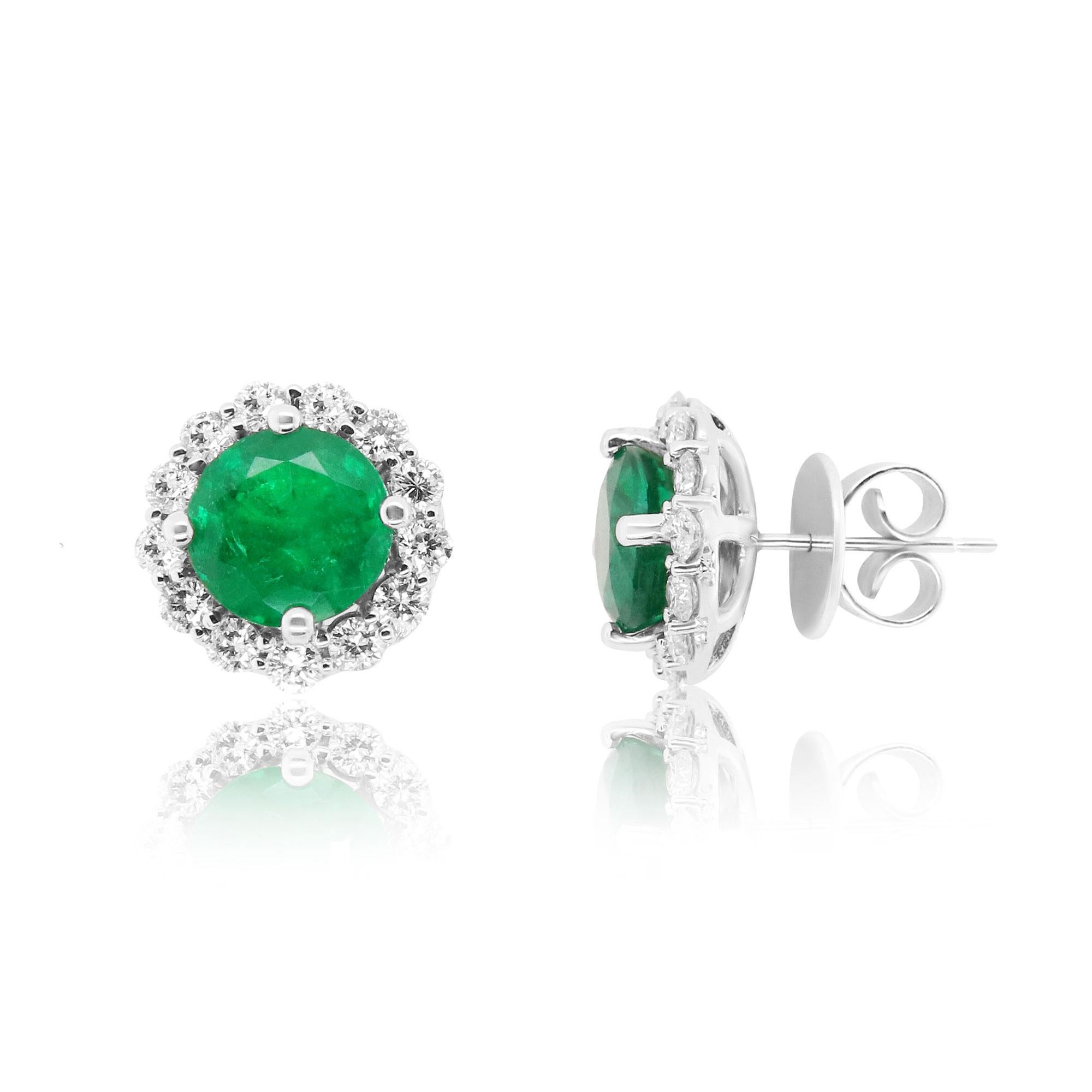 Material: 18k White Gold 
Stone Details: 2 Round Shaped Emeralds at 4.64 Carats Total - Measuring 8.6 mm
Diamond Details: 26 Brilliant Round White Diamonds at 1.37 Carats. Clarity: SI / Color: H-I

Fine one-of-a-kind craftsmanship meets incredible