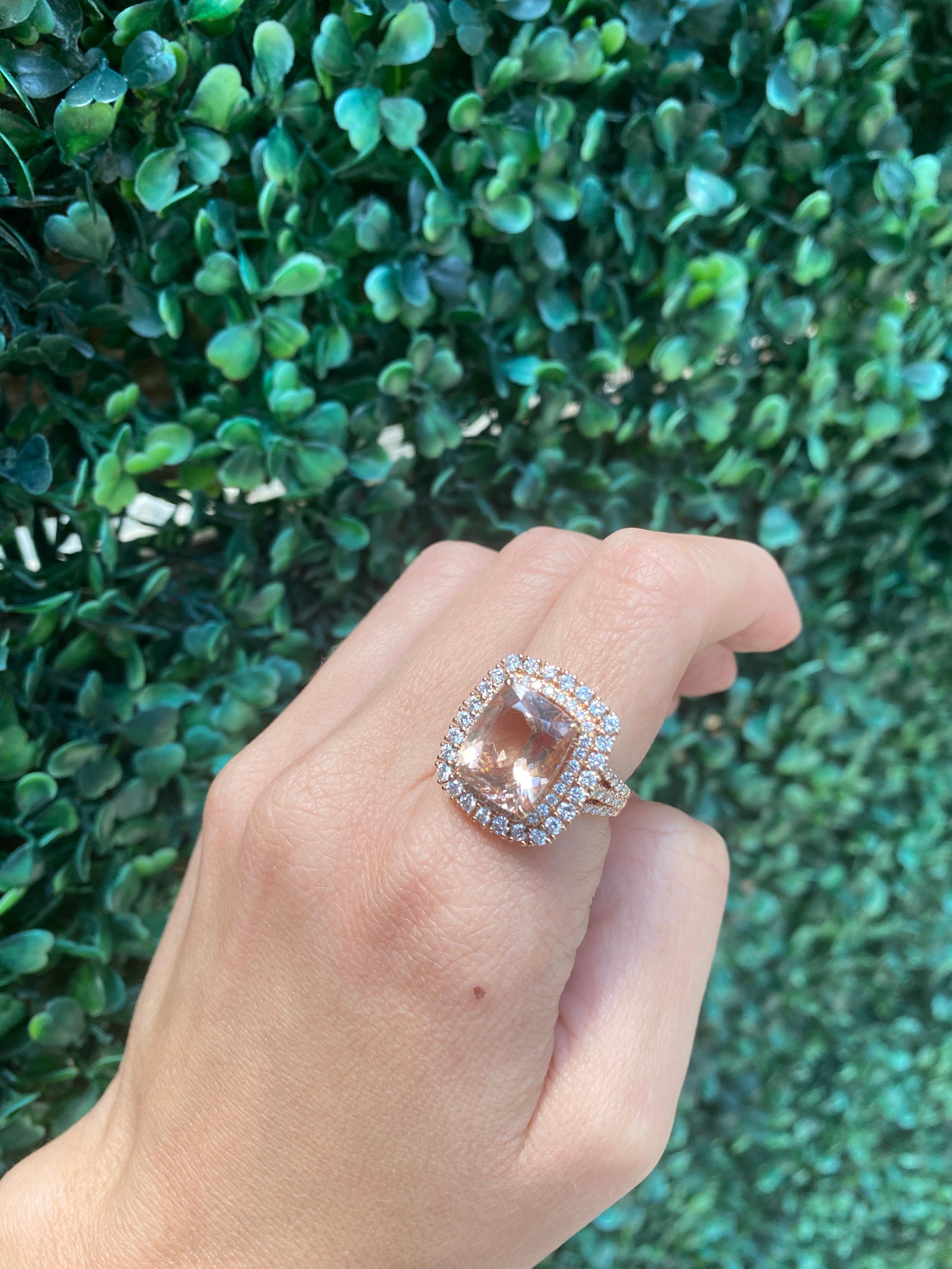 This triple shank cocktail ring features a 4.65 carat cushion cut morganite accented by 1.40 carat total weight in round brilliant diamonds set in 14 karat rose gold. This ring is a size 7 but can be resized upon request. 
Measurements: Morganite
