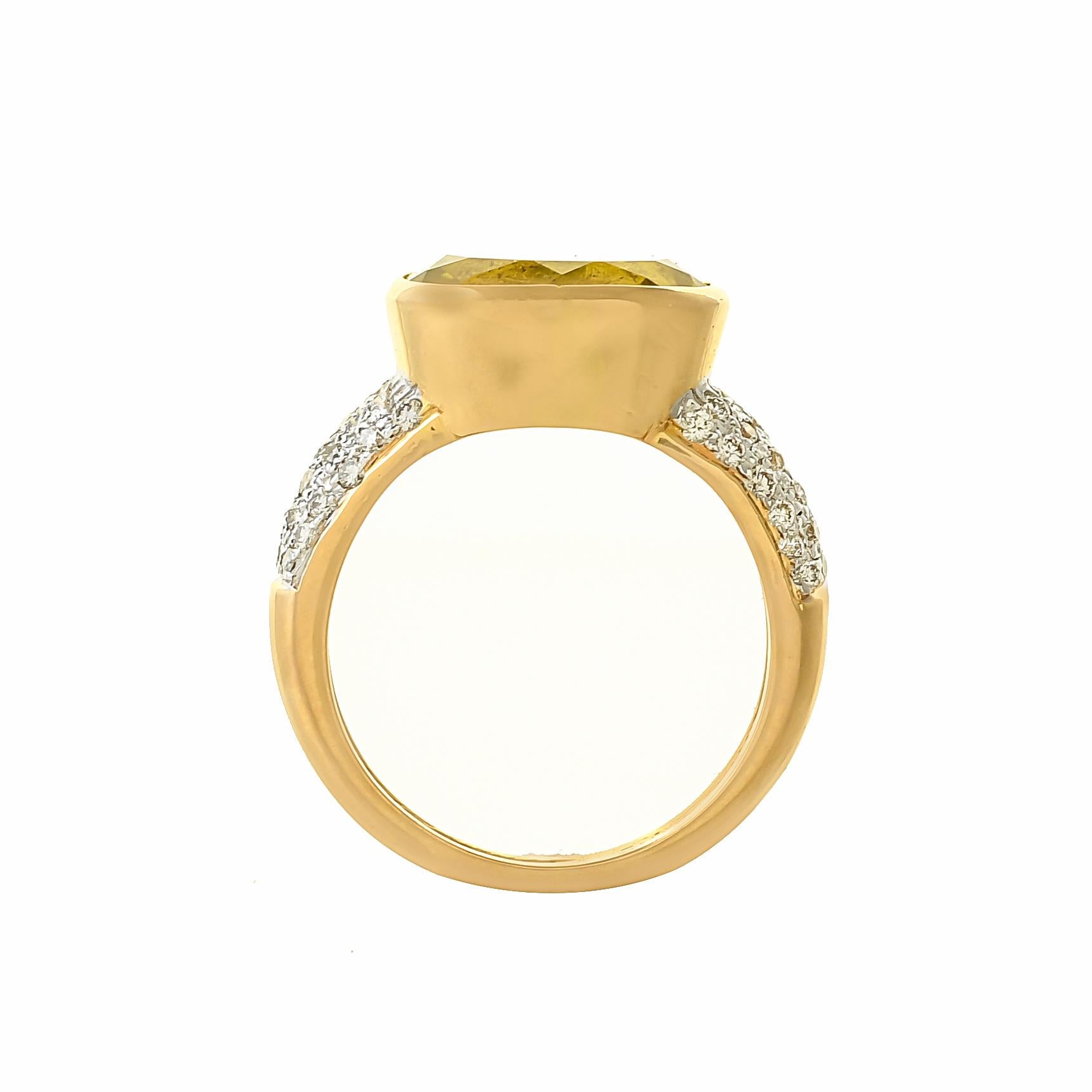Design to encourage focus and clarity of thoughts, this beautiful ring features oval-shaped lemon quartz weighing approximately 4.65 carats, inserted within a yellow gold bezel on a tapering band of 18 karats yellow gold pave set with round diamonds