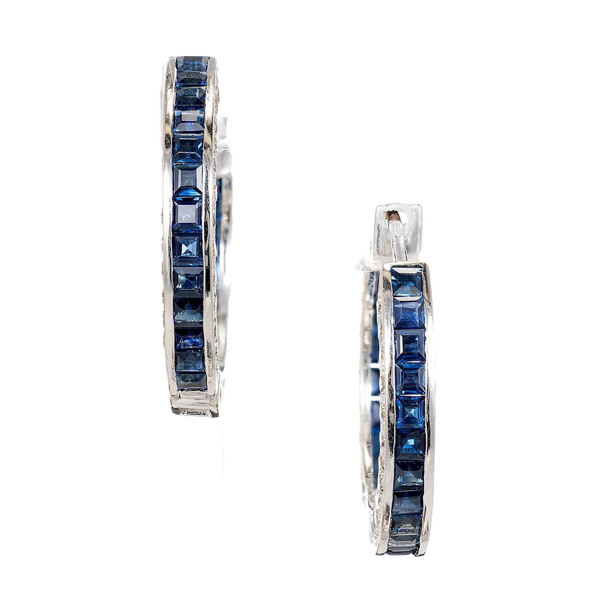 Huggie style sapphire and diamond 18k white gold hinged hoop earrings with Pavé set Diamond sides and channel set inside out center and back.

46 square blue Sapphires, approx. total weight 3.65cts, 2mm
96 round Diamonds, approx. total weight