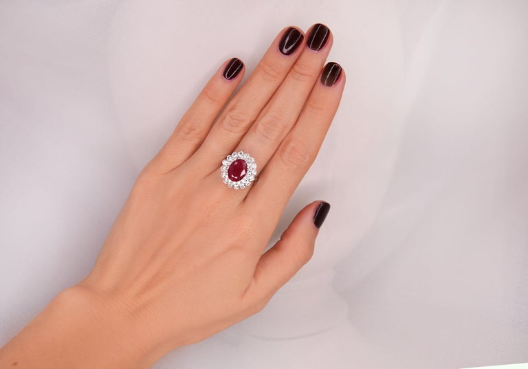 4.65 CTW Ruby 18K White Gold Diamond Ring

Stamped: 18K
Total Ring Weight: 6.4 Grams
Ruby Weight 2.80 Carat (9.70x7.80 Millimeters)
Diamond Weight: 1.85 carat (F-G Color, VS2-SI1 Clarity )
Face Measures: 18.85x17.60 Millimeter