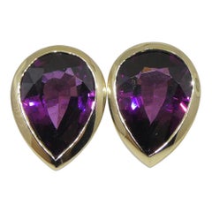 Orecchini a perno con granato rodolite 4,66ct in oro giallo 14k