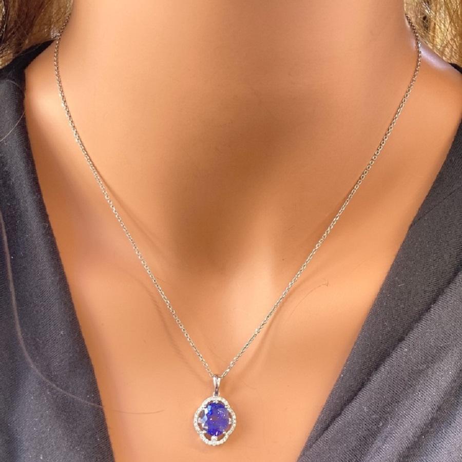 Oval Cut 4.67 Carat Blue Oval Tanzanite & Diamond Pendant In 14k White Gold For Sale