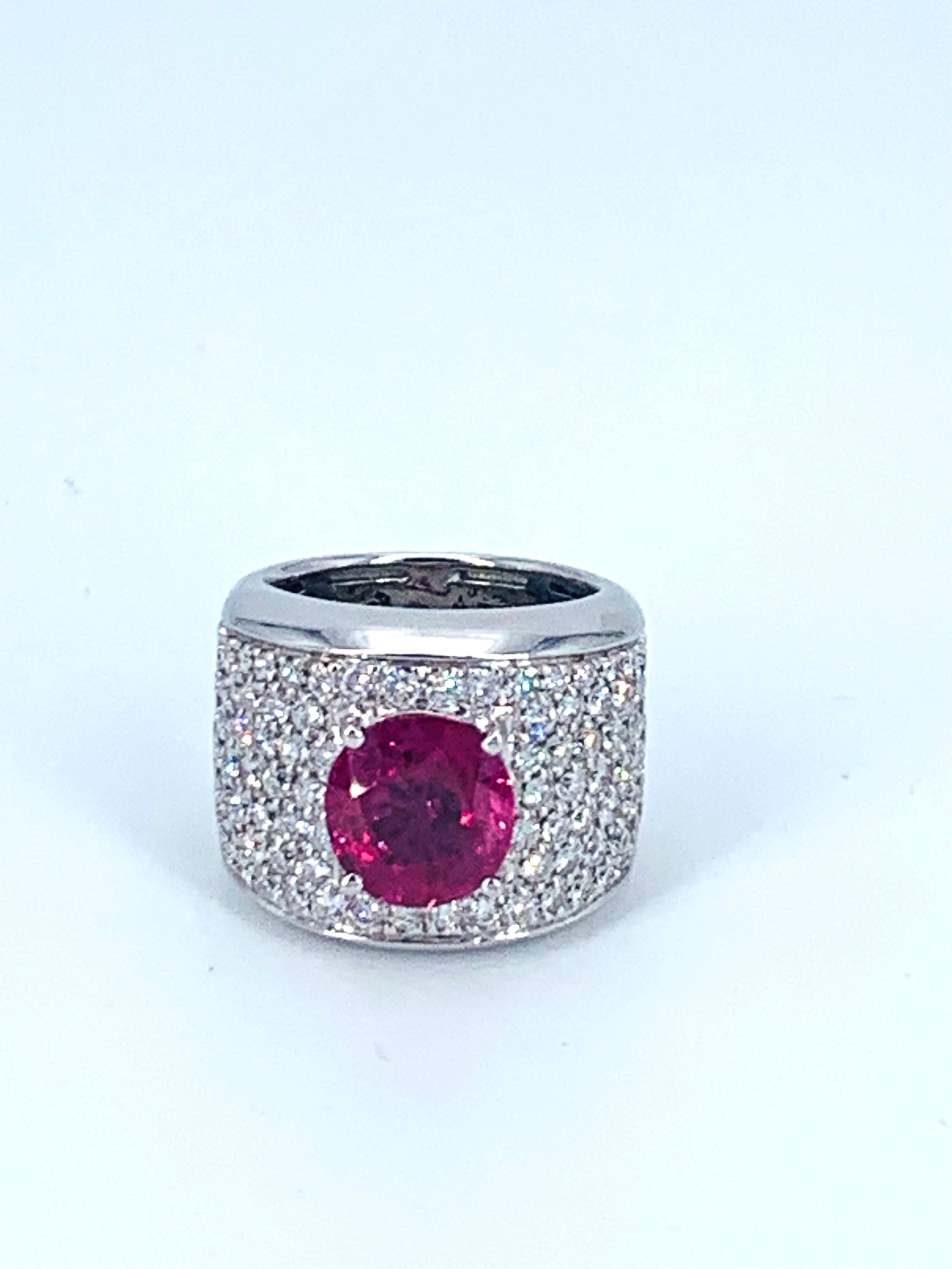This 4.67 Carat Burma Ruby and 3.25 Carat Diamond band ring makes a seriously impressive statement on the hand. 
The ring is set in 18Kt white Gold with the Ruby in the heart of the face surrounded by wonderfully bright natural white Diamonds half