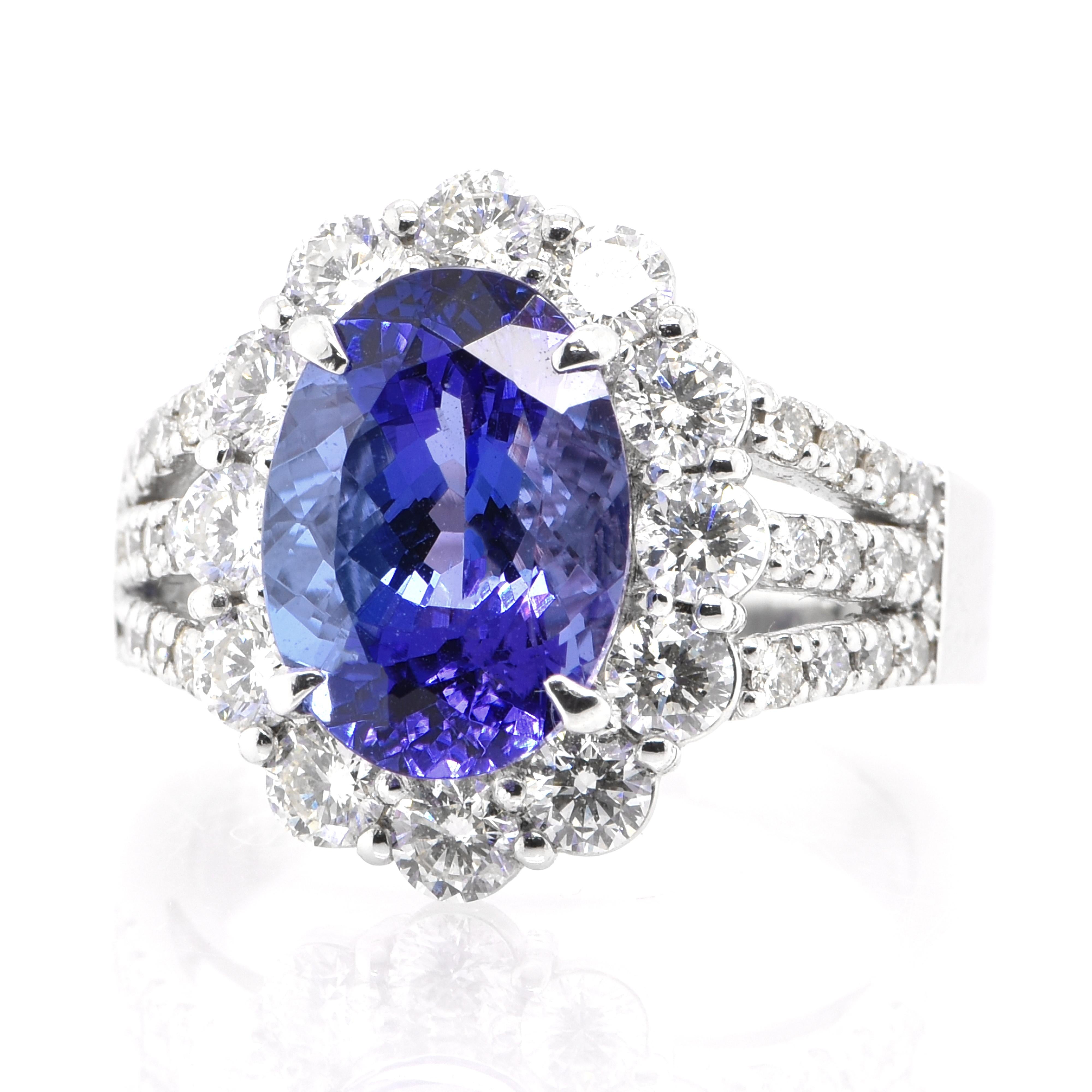 A beautiful Cocktail Ring featuring a 4.67 Carat Natural Tanzanite and 1.48 Carats of Diamond Accents set in Platinum. Tanzanite's name was given by Tiffany and Co after its only known source: Tanzania. Tanzanite displays beautiful pleochroic colors