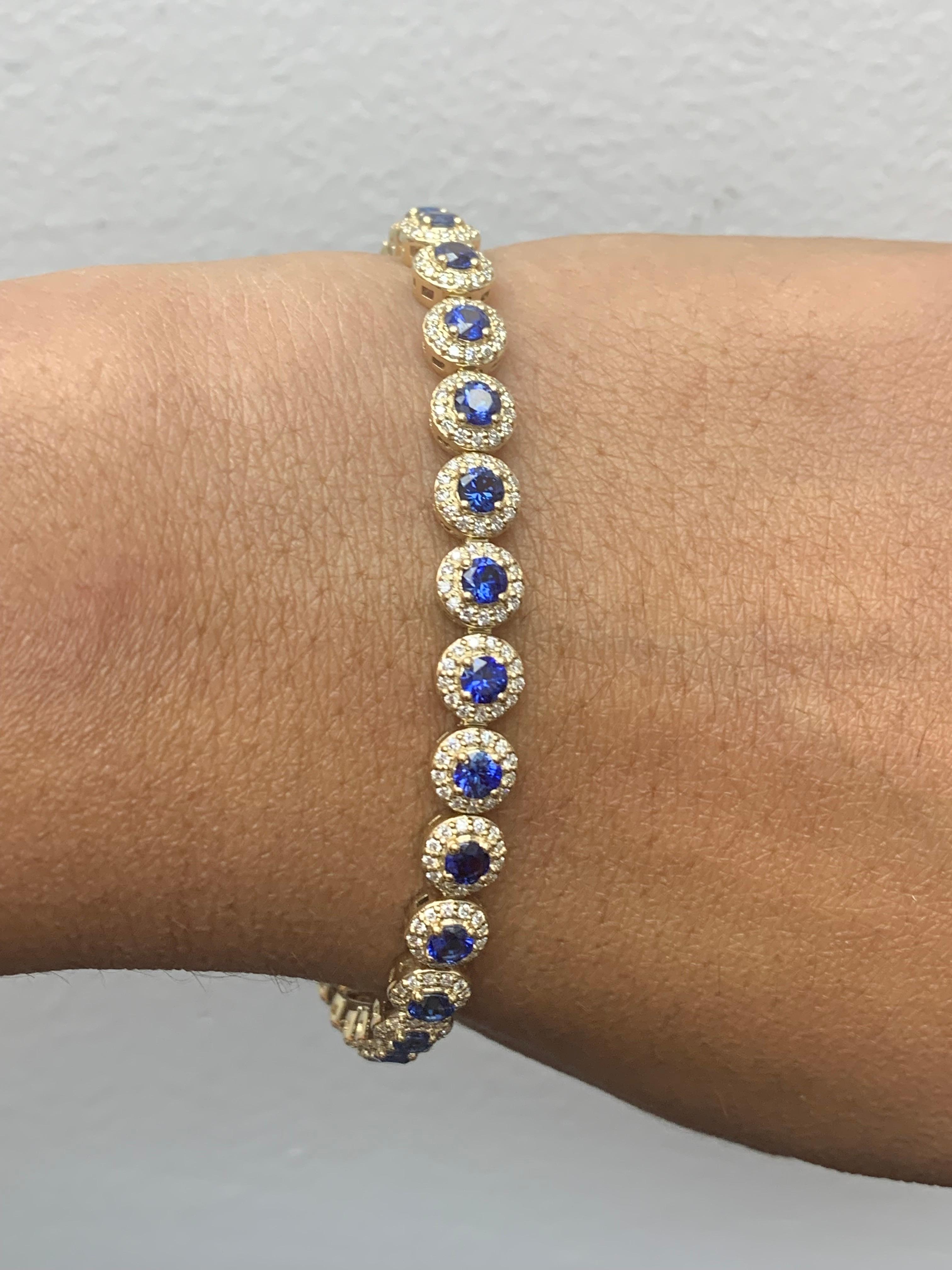 Add color to your style with this gorgeous Blue Sapphire bracelet. Features 29 Round cut blue sapphires surrounded by a single row of sparkling 377 round diamonds in a halo setting.  Sapphires and diamonds weigh 4.67 carats and 1.57 carats total